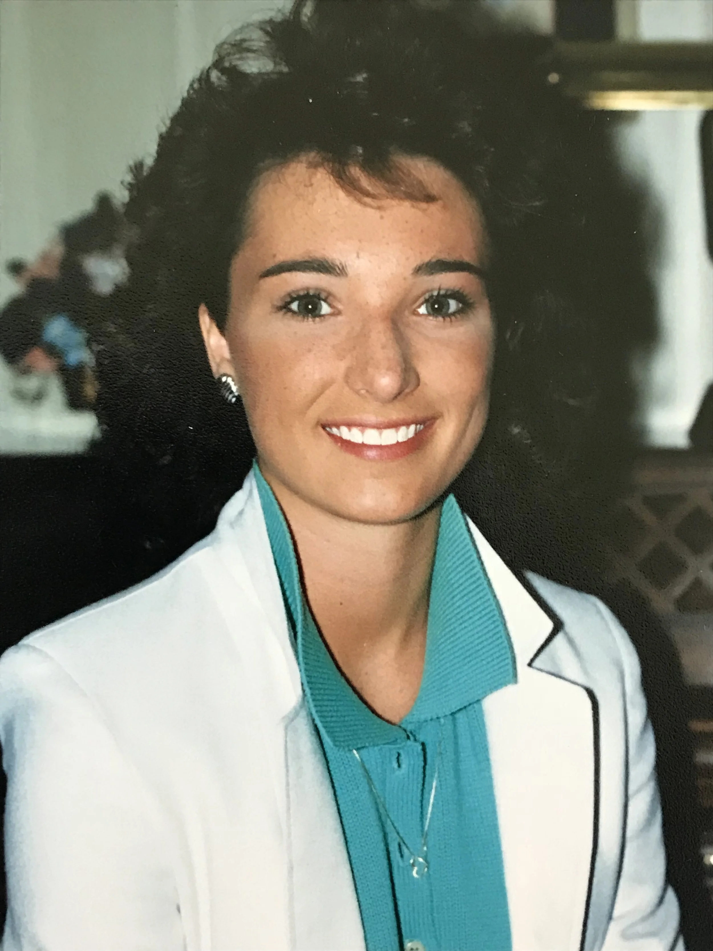 Tamara Rowe wearing a white coat and a turquoise jacket in her High school years.