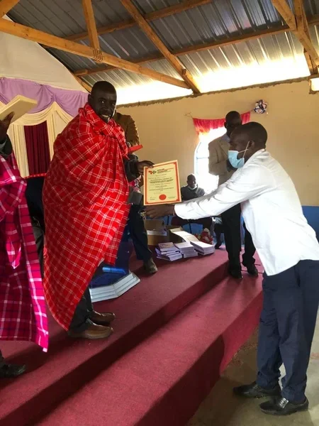 Pastor receiving his training certificate in Kenya