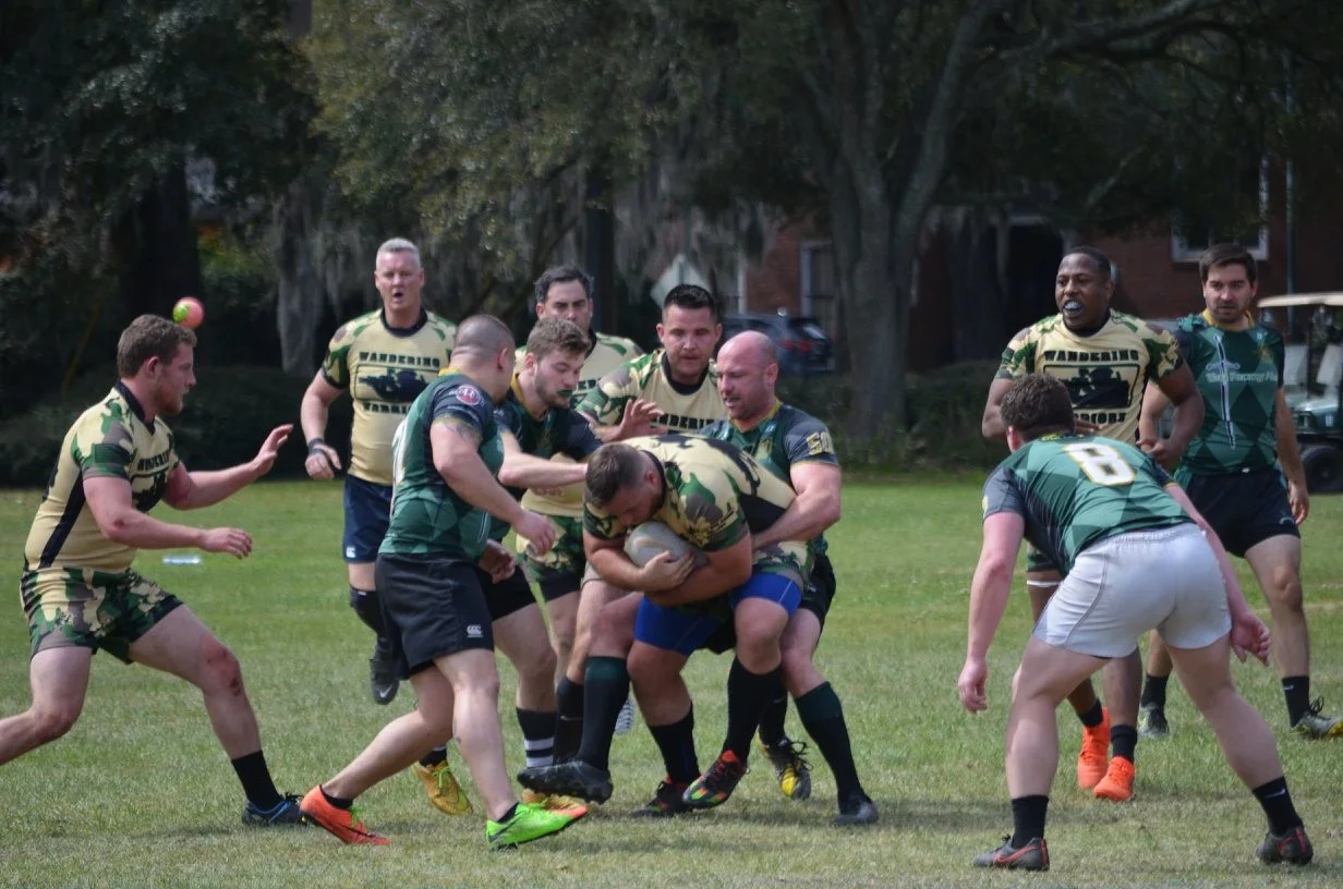 Photo Credit - Meg Thompson Wandering Warrior takes the ball into contact St Paddy’s Day 2018 - Savannah