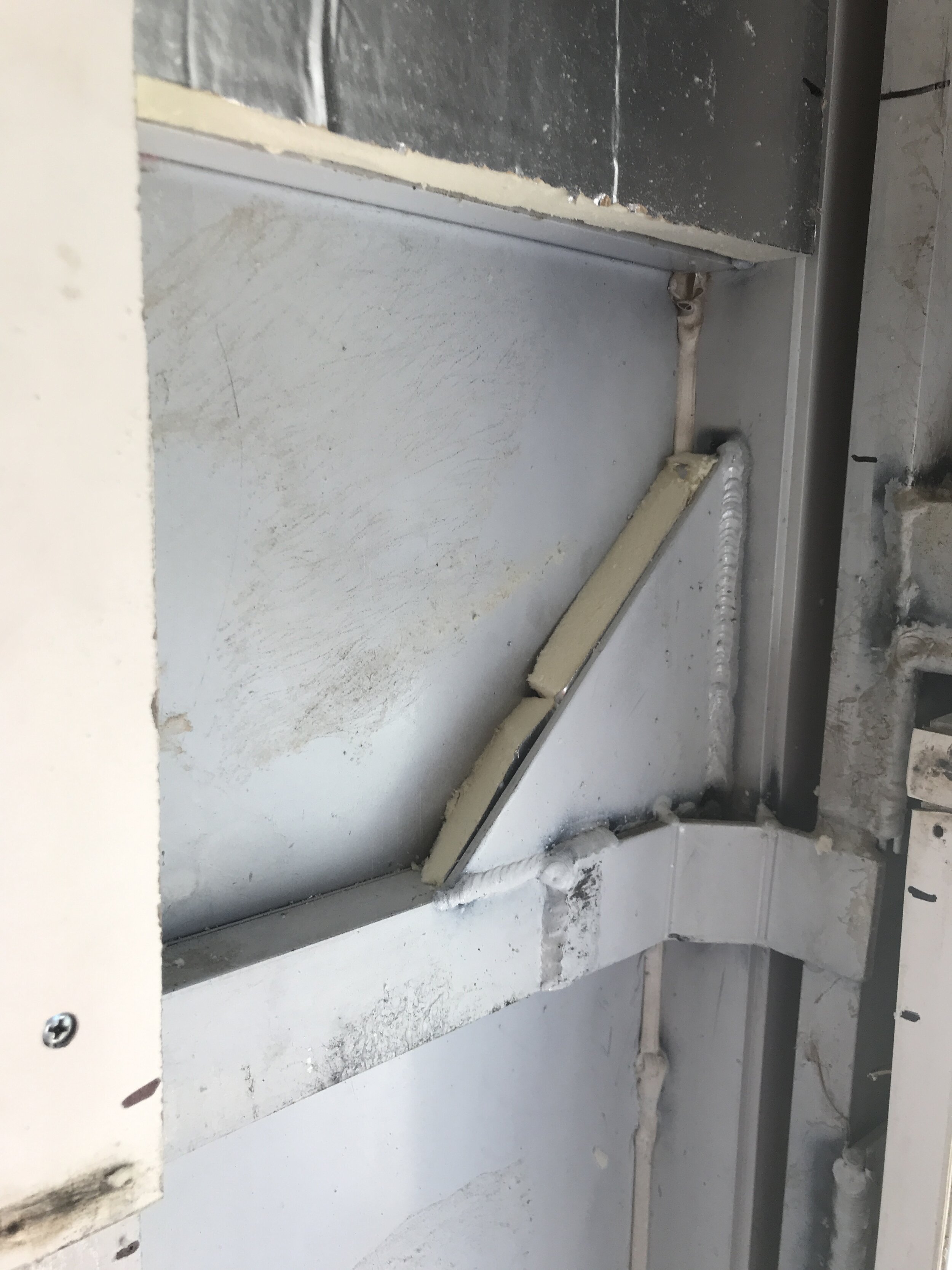 Insulation behind supports.JPG