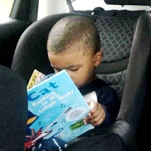 black boy car seat book in lap CROP copy.jpg