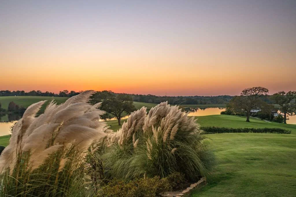 Extensive landscaping, green spaces, and stone masonry serve to ground this expansive project in its hearty Texas roots.