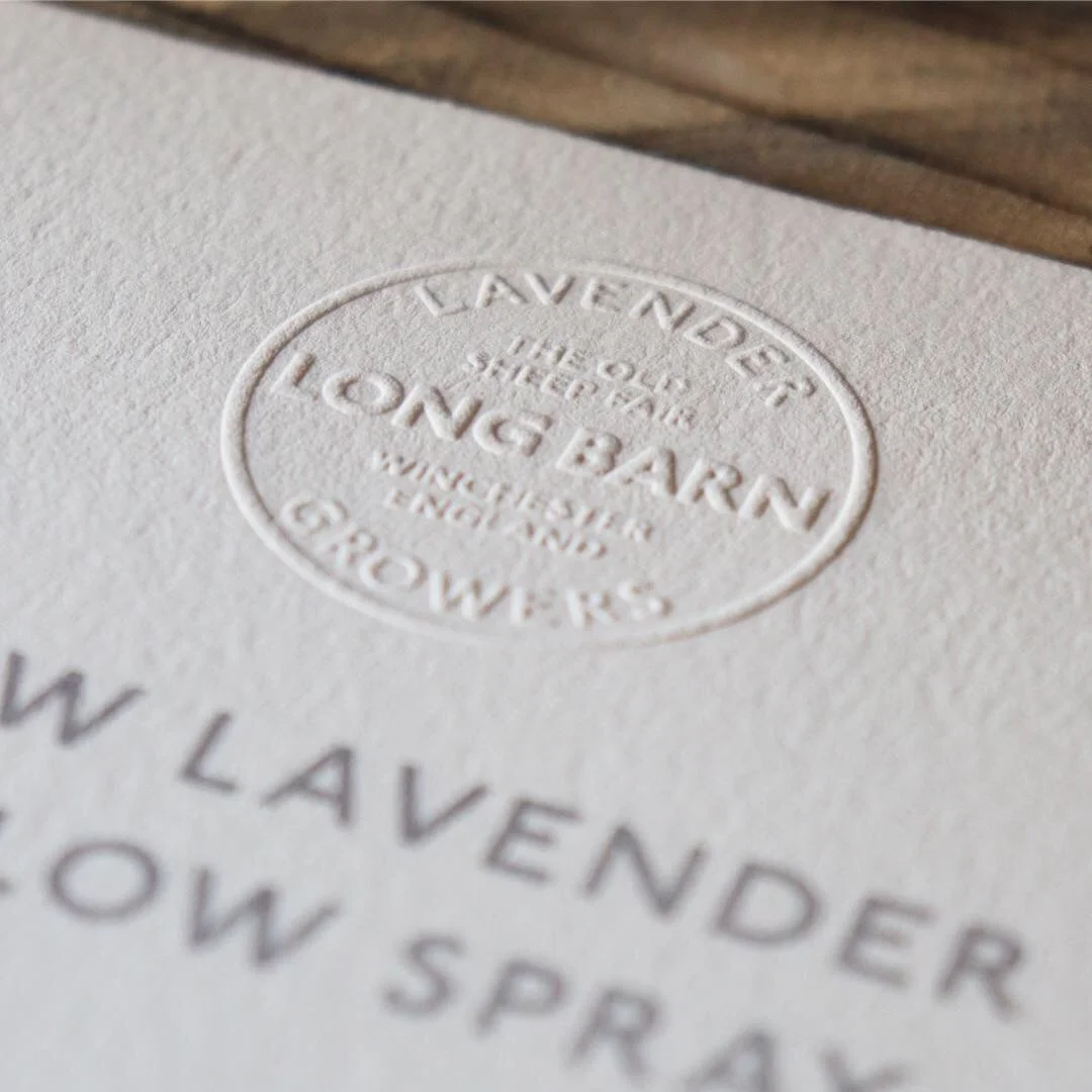 Embossed roundel logo on point of sale at Long Barn, Hampshire (Copy)