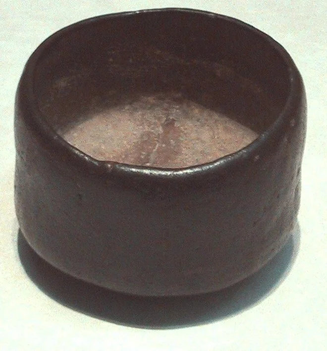 Wabi-sabi: Acceptance of the innate beauty that naturally comes with im. "Black_Raku_Tea_Bowl.jpg"(c) by Chris 73 and is freely available at under the creative commons cc-by- sa 3.0 license.