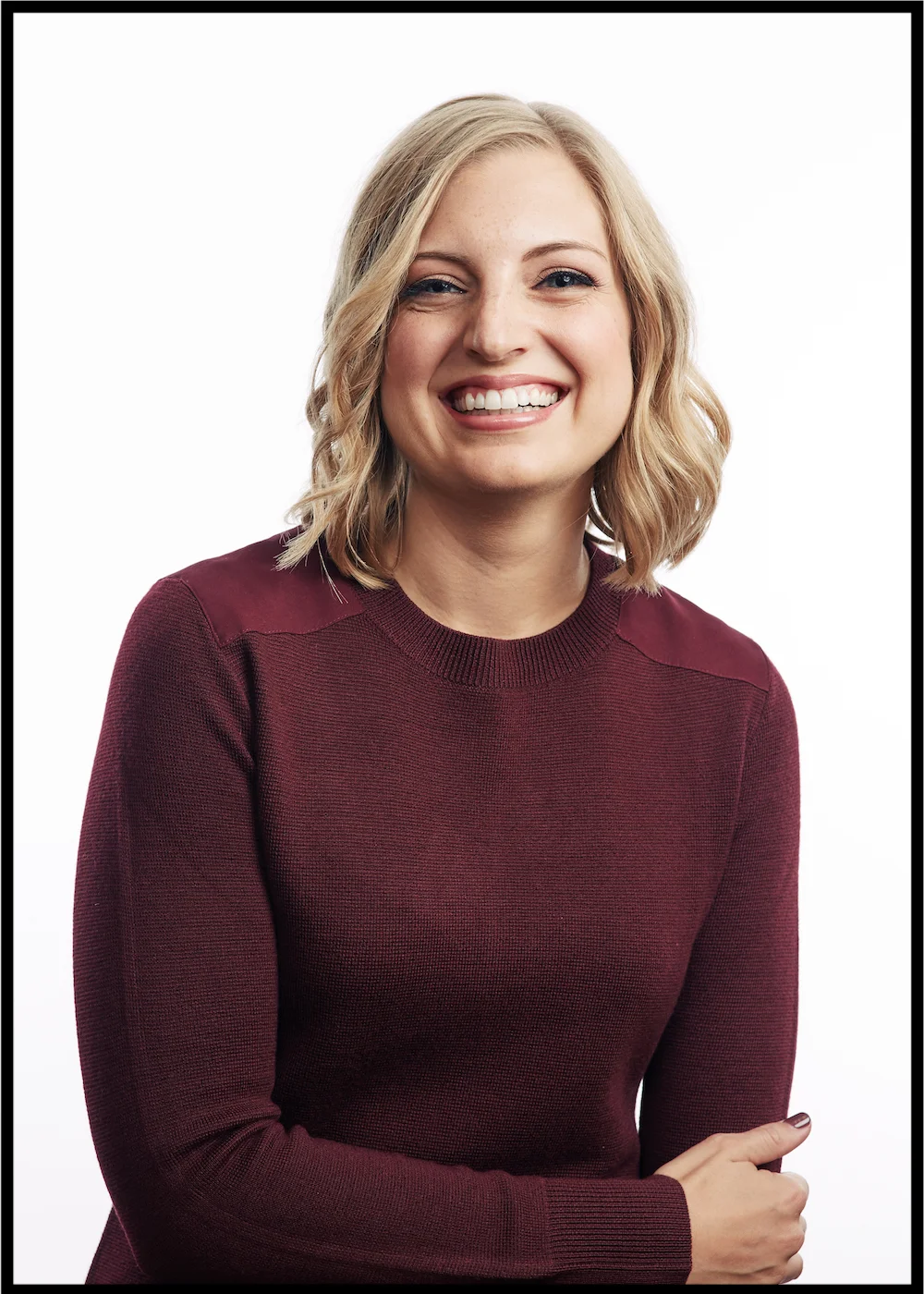 Stacy Kessler headshot laughing with black frame.jpg