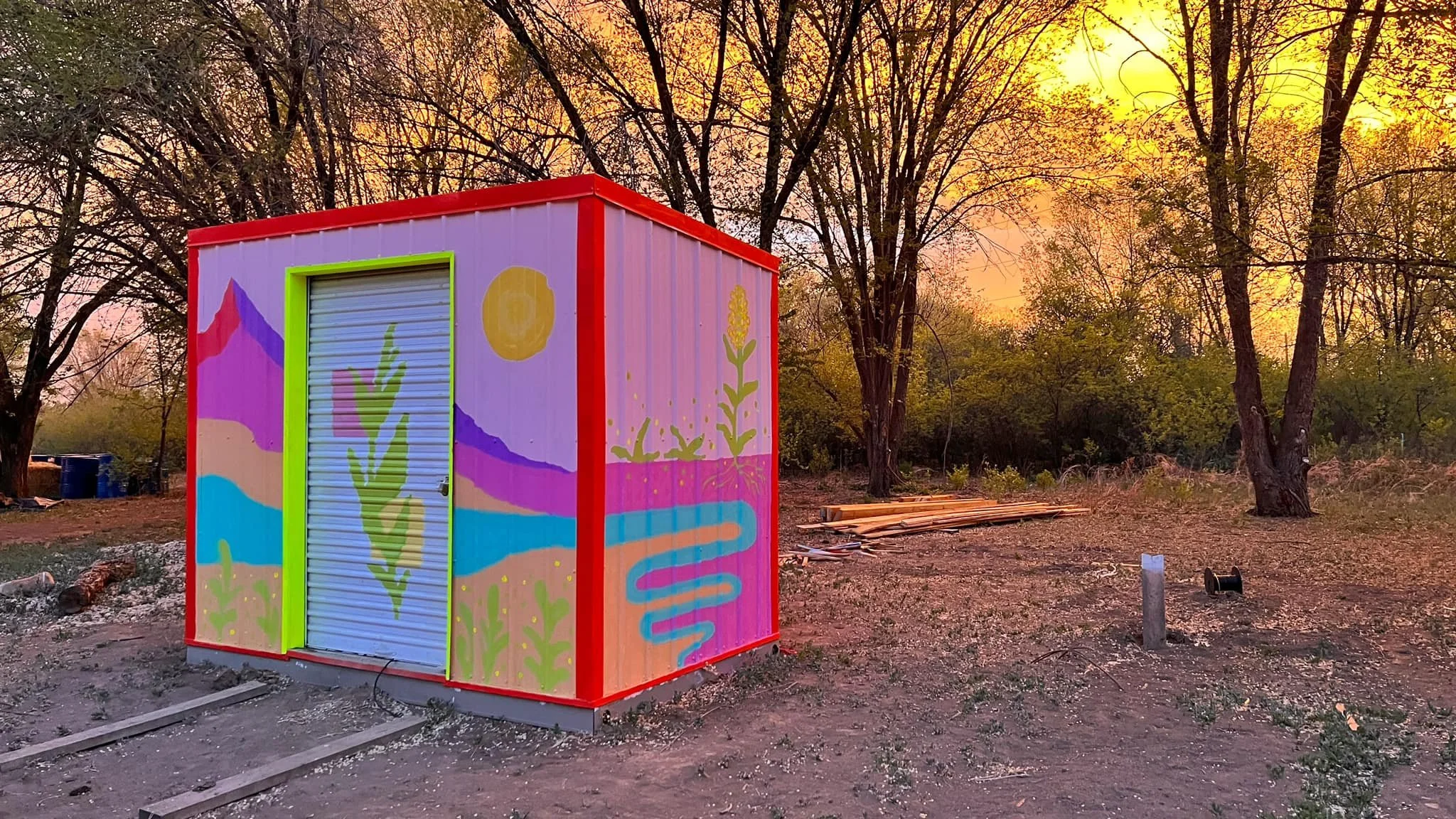  I was hired by Vista Grande High School to lead a student workshop on site at Taos Land Trust. Vista Grande works along side with the Land Trust, facilitating the public garden. The mural was done in honor of the local land and students involved in 