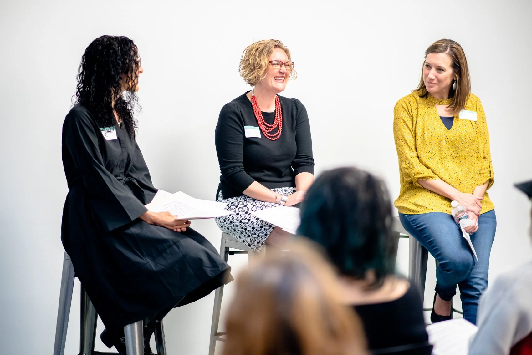 Jess speaking on a panel alongside 2 other women