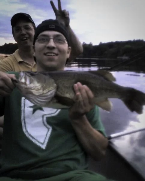 “That’s my father behind me it was taken from my mother when her, my father, and I crammed into a canoe to go fishing before my father or I owned a boat.”