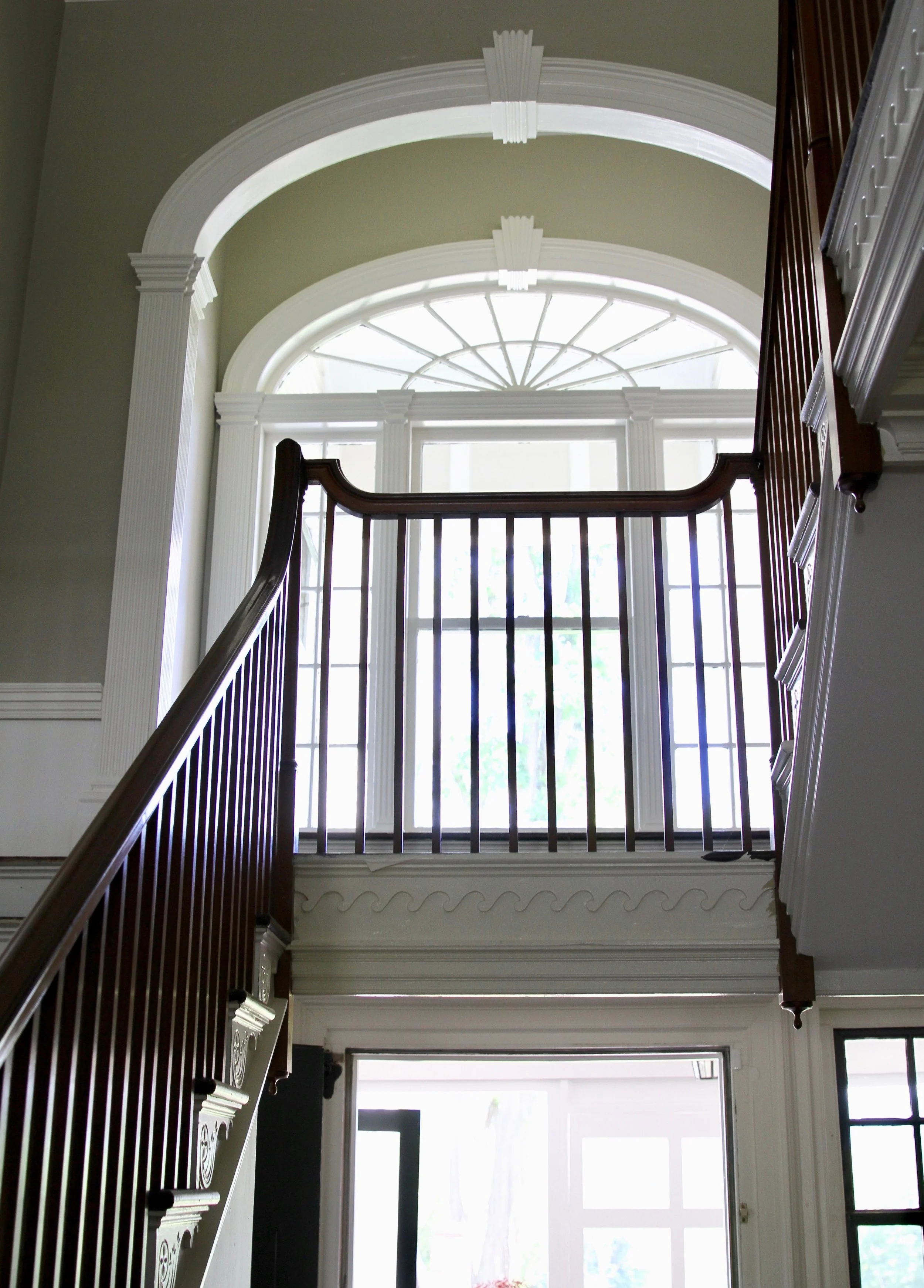 The Grand Staircase The graceful sweep of the original mahogany bannister.