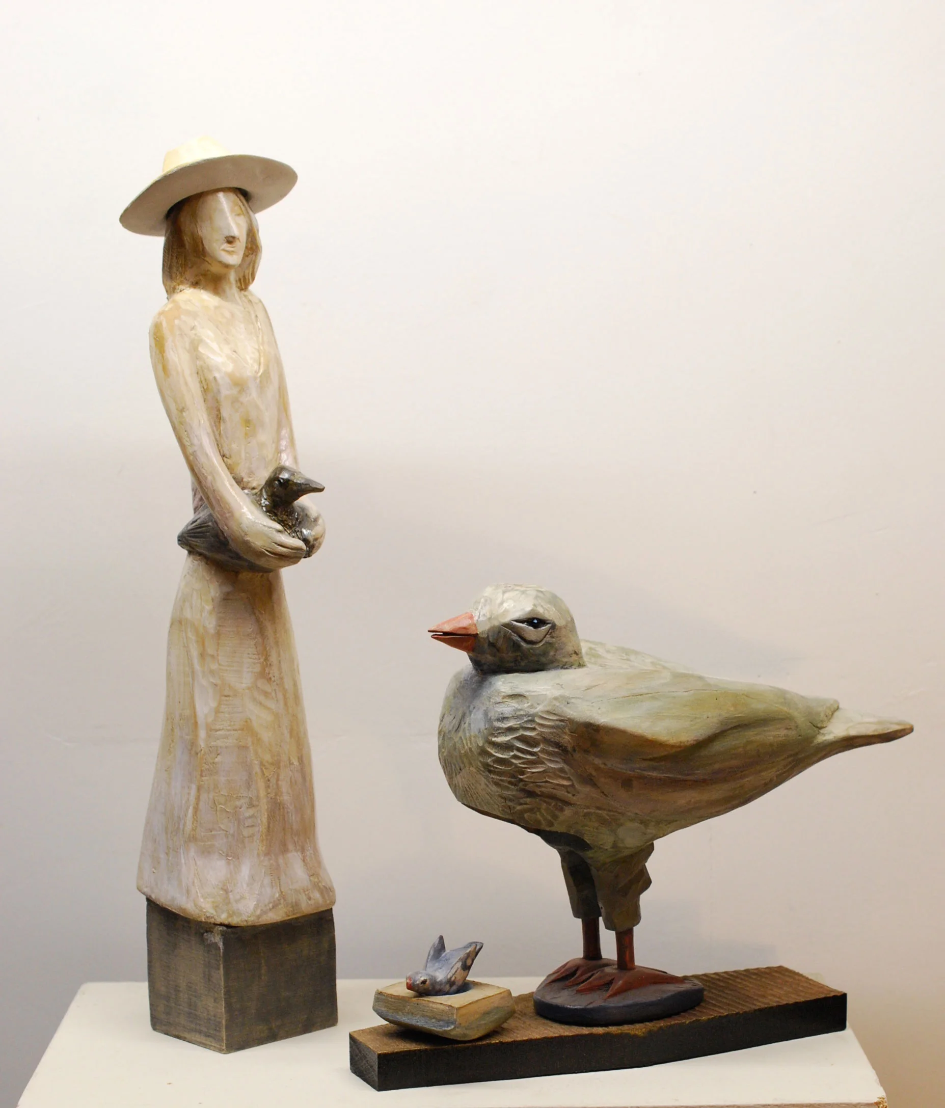 Holding Feathers / Plover carved and painted wood 18" x 4" x 4" SOLD Inquire >
