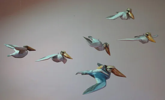 Pelicans in flight, 2015 carved and painted basswood varying sizes