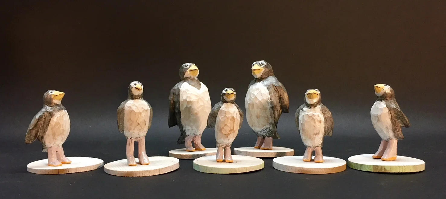 Penguin Lineup carved and painted wood varying sizes 4” x 2” x 2”