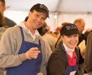 Patti Dann and her husband, Paul, promote Cafe Indigo vegan baked goods during a food expo at New York City's Javits Center.