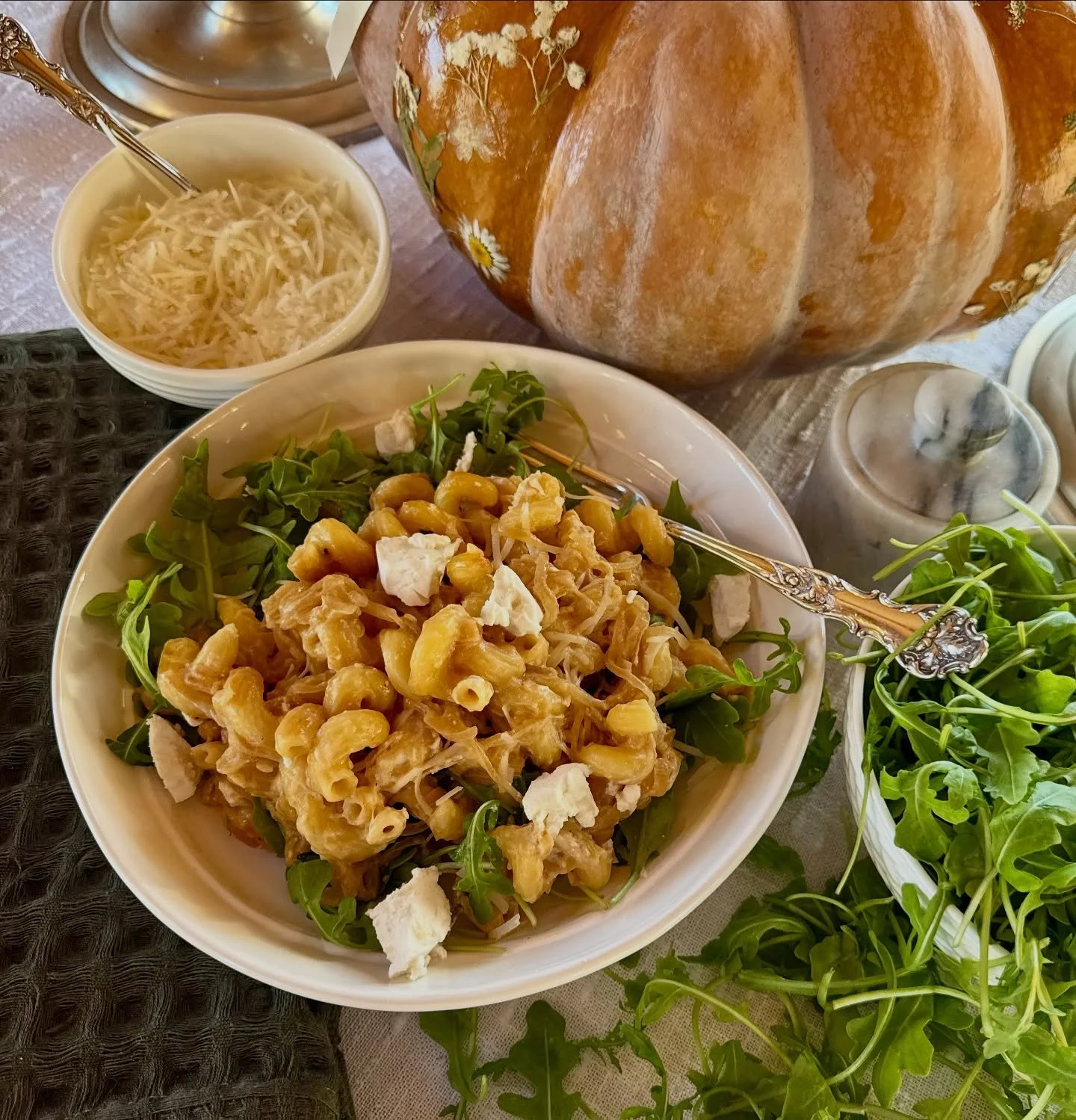 Caramelized Onion Goat Cheese Pasta is my quintessential cold day meal. It is a savory, sweet goat cheese pasta bake from heaven. The arugula is the perfect bite of pepper and freshness that you need to balance the heaviness of the pasta.