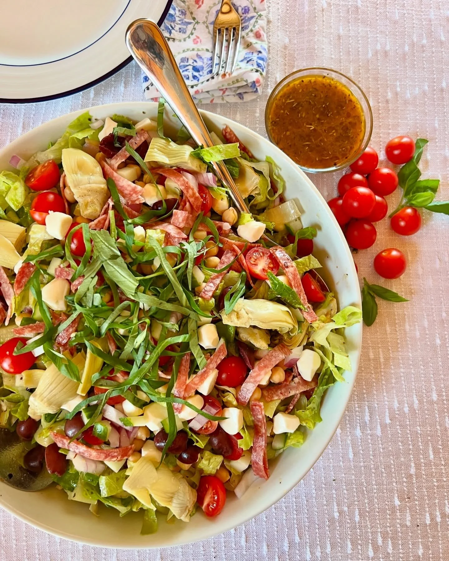 Italian Chopped Salad is a vibrant, hearty dish that captures the essence of an Italian sub in salad form. It features a crisp romaine heart base, generously topped with an assortment of Italian meats, a variety of fresh and cured vegetables, and del