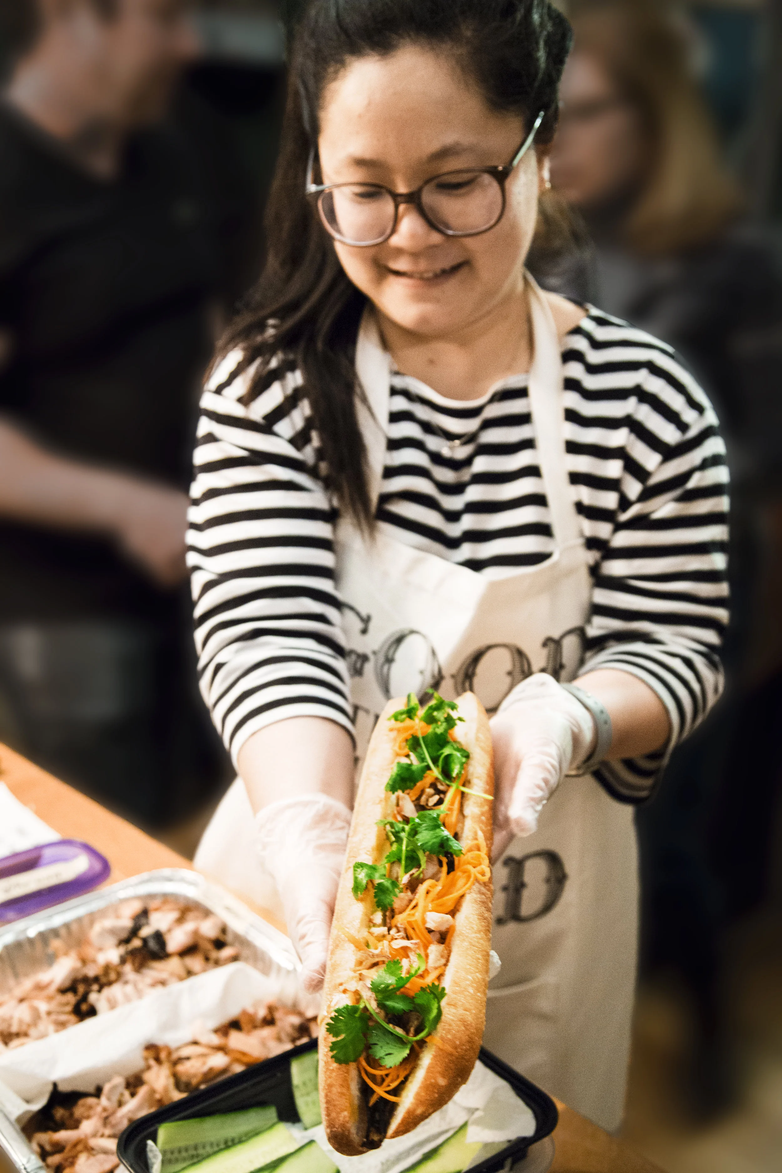 Tuyen.BanhMi.holding sandwich.jpg