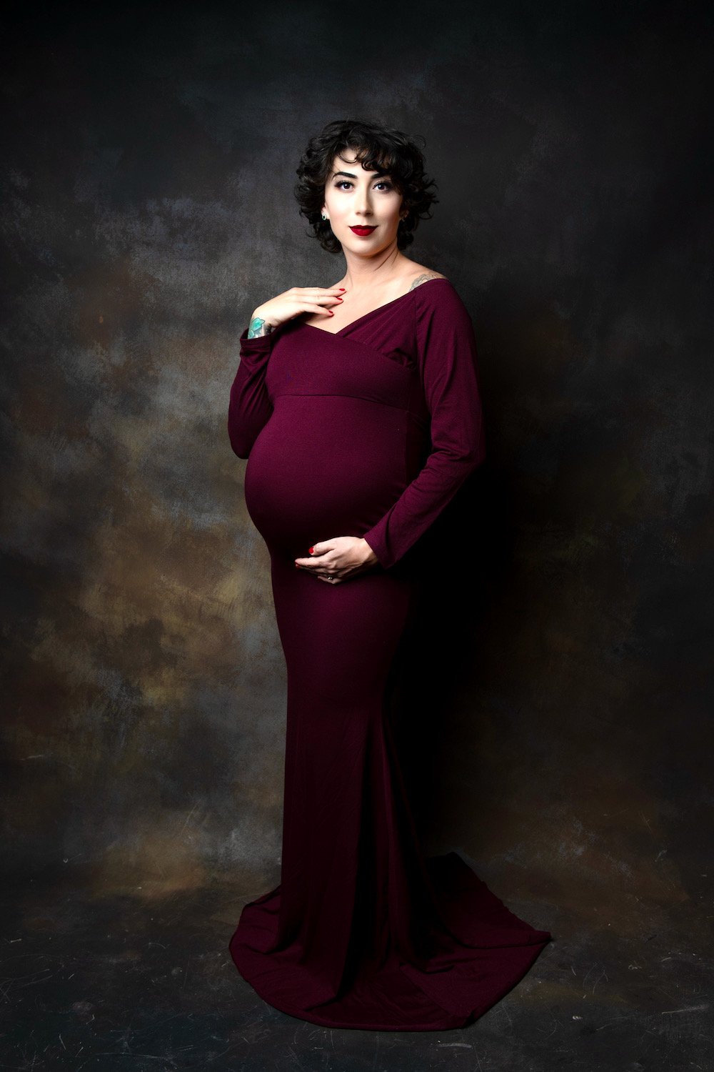 maternity-burgundy-dress-in-studio.jpeg