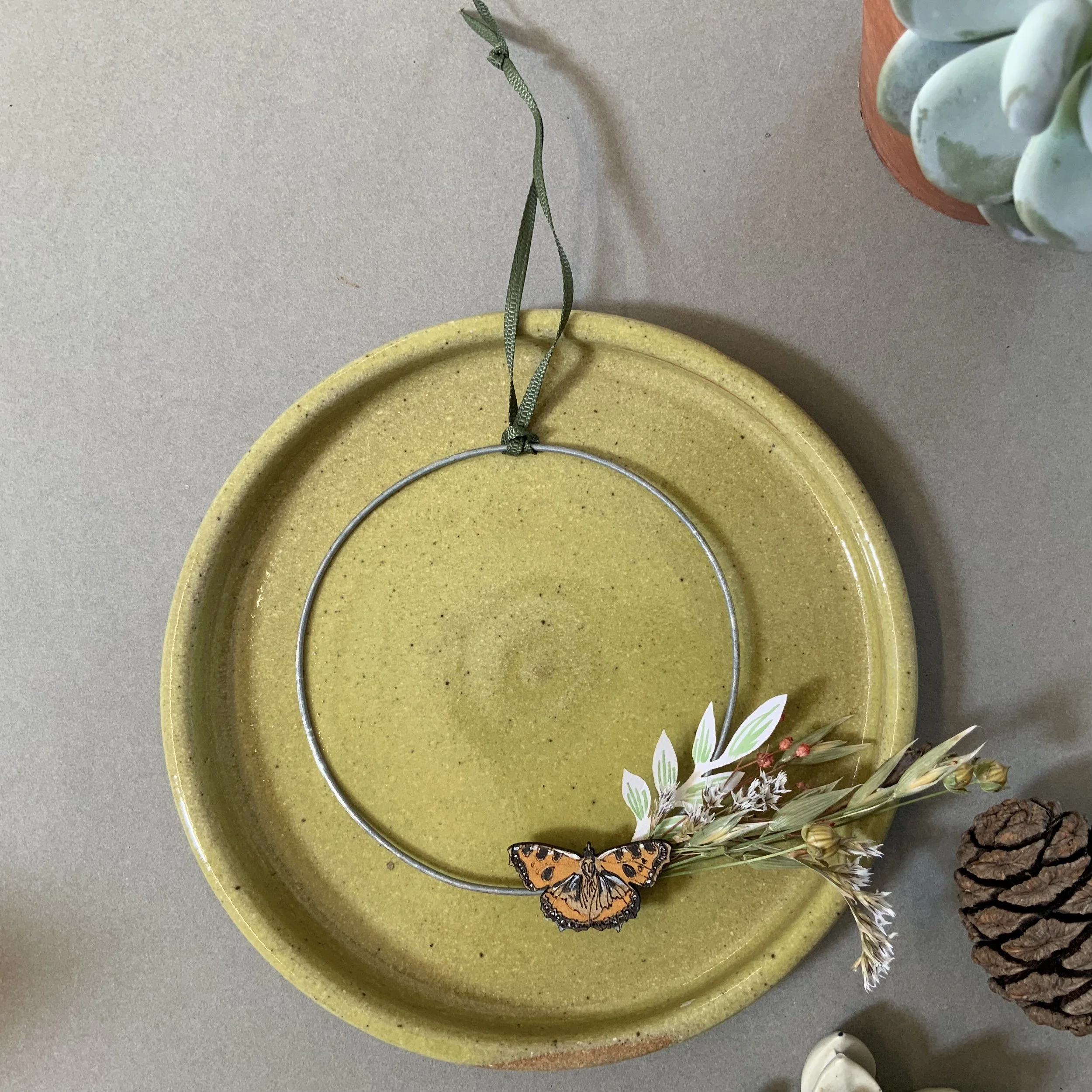 Hand crafted tortoiseshell butterfly mounted on a slim wire wreath frame, with delicate dried foliage and seed heads. (Copy)