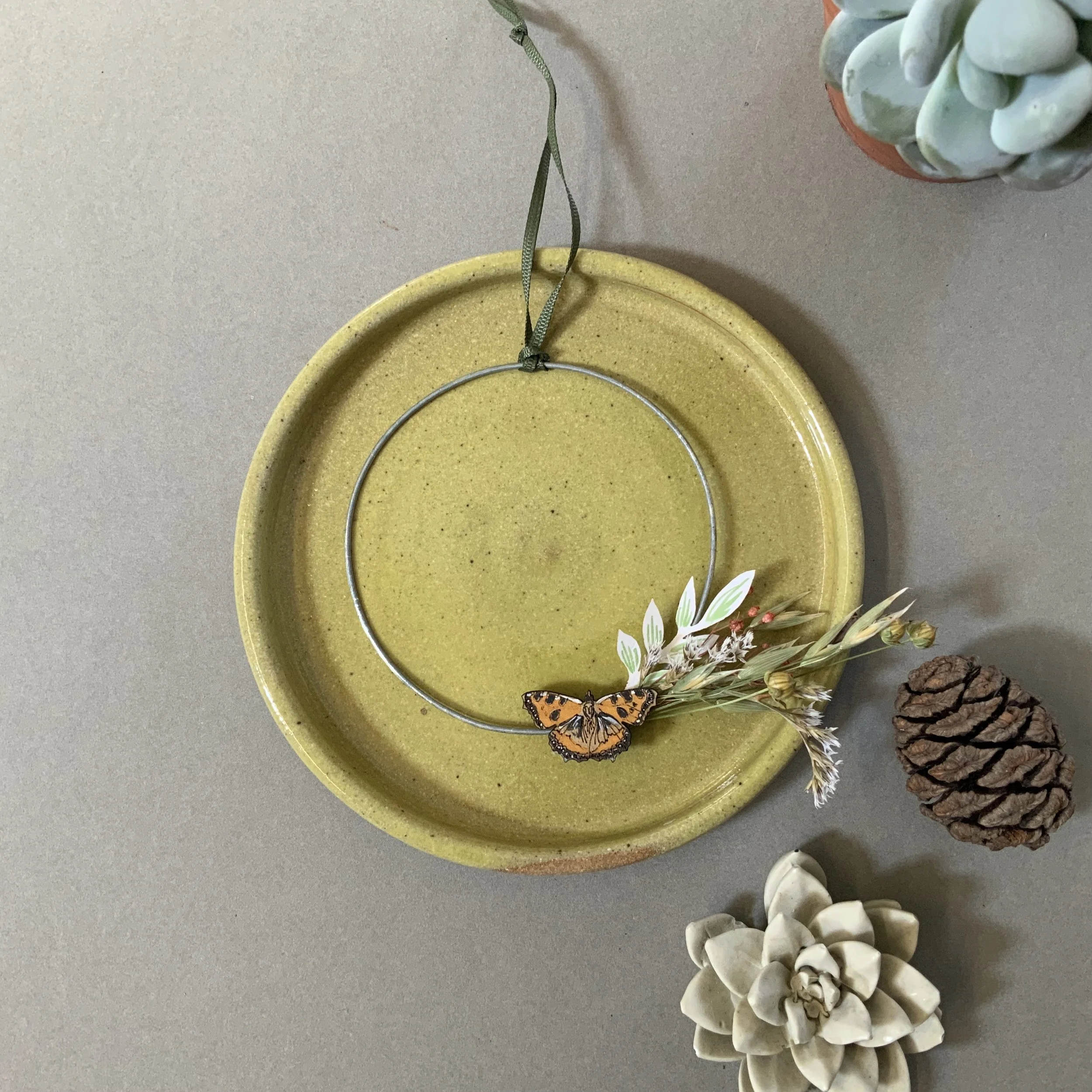 Hand crafted tortoiseshell butterfly mounted on a slim wire wreath frame, with delicate dried foliage and seed heads. (Copy)