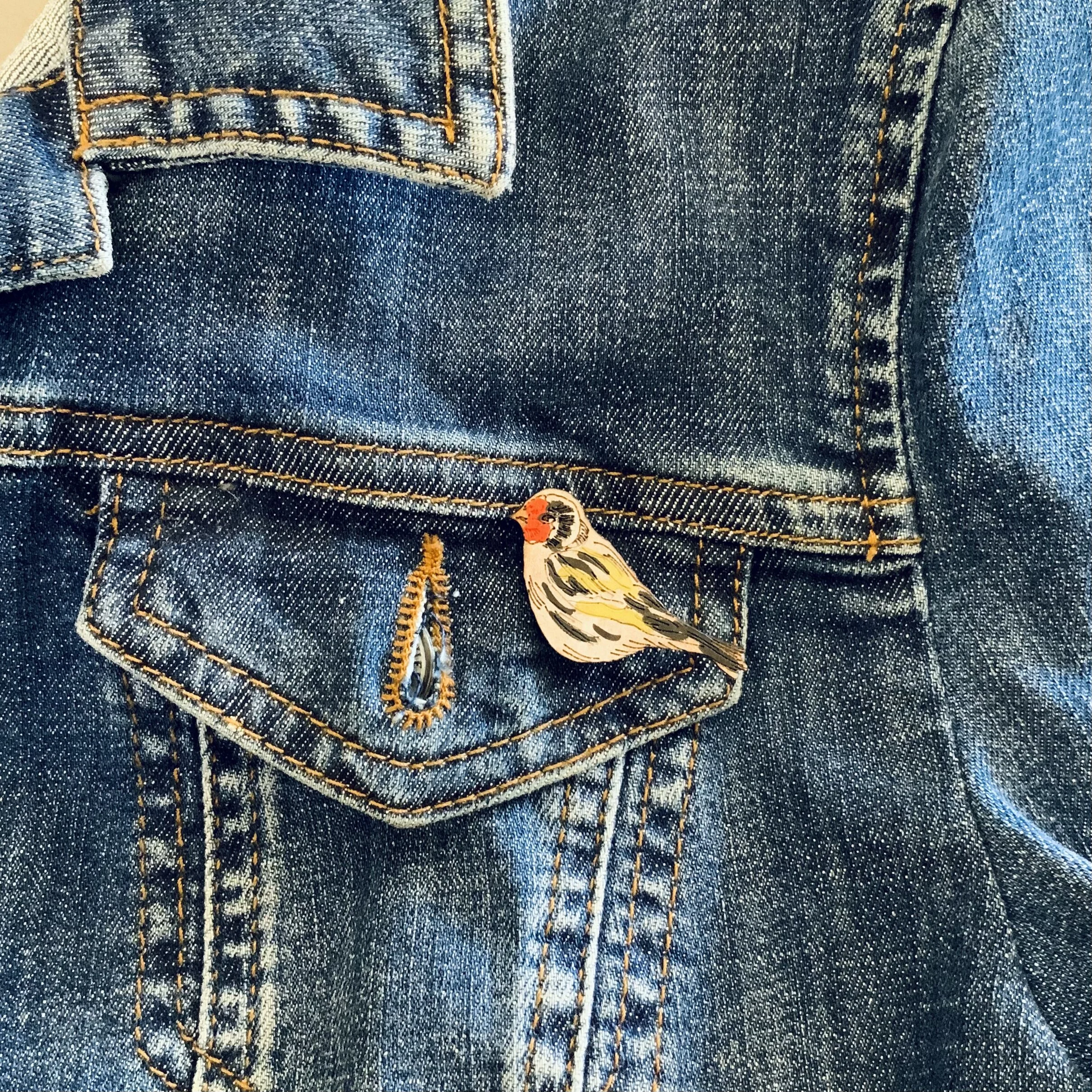 goldfinch mini pin on jacket