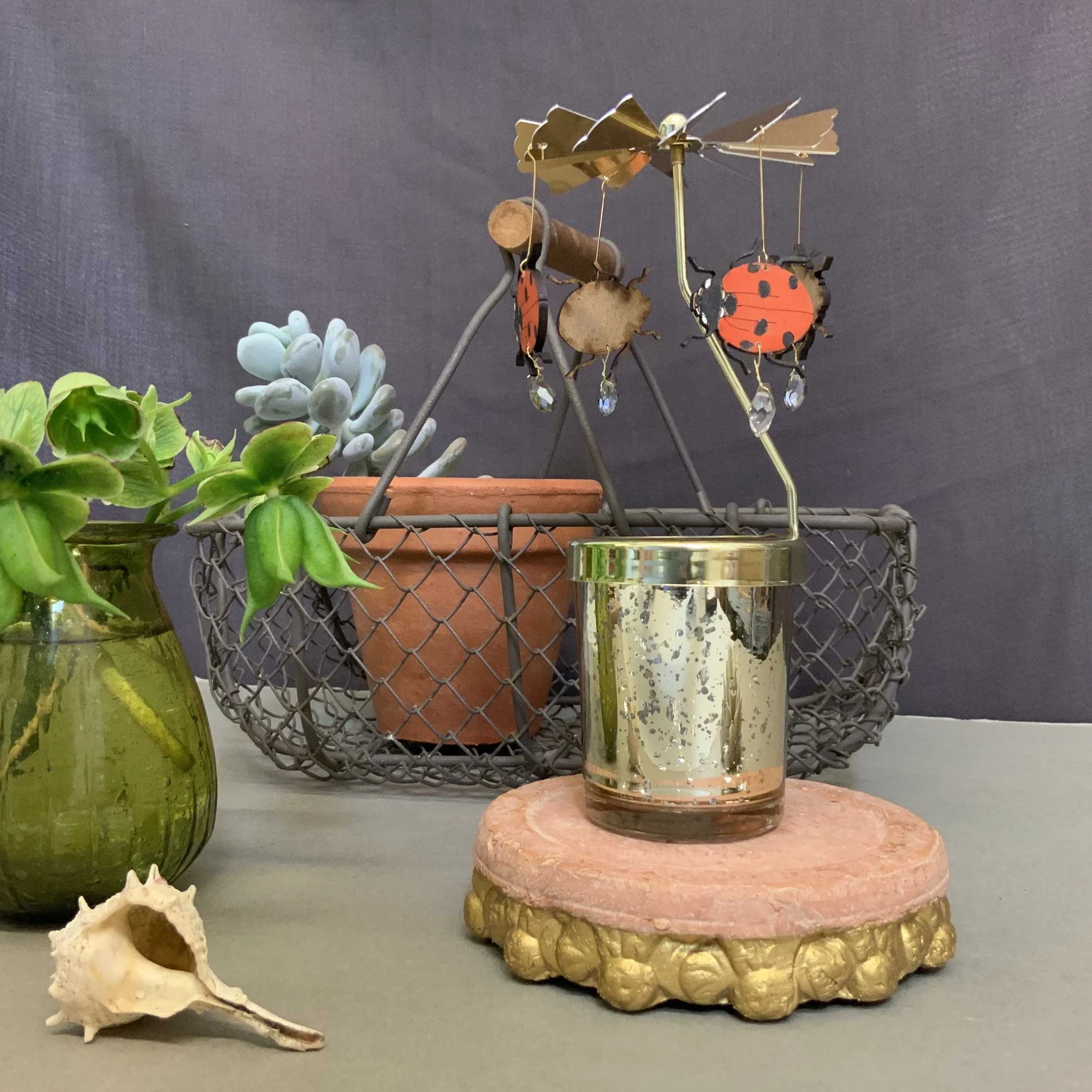 Hand painted ladybirds give a summery update to Lily Faiths candle carousels, perfect for twinkly evenings with their grey czech glass briolette details.