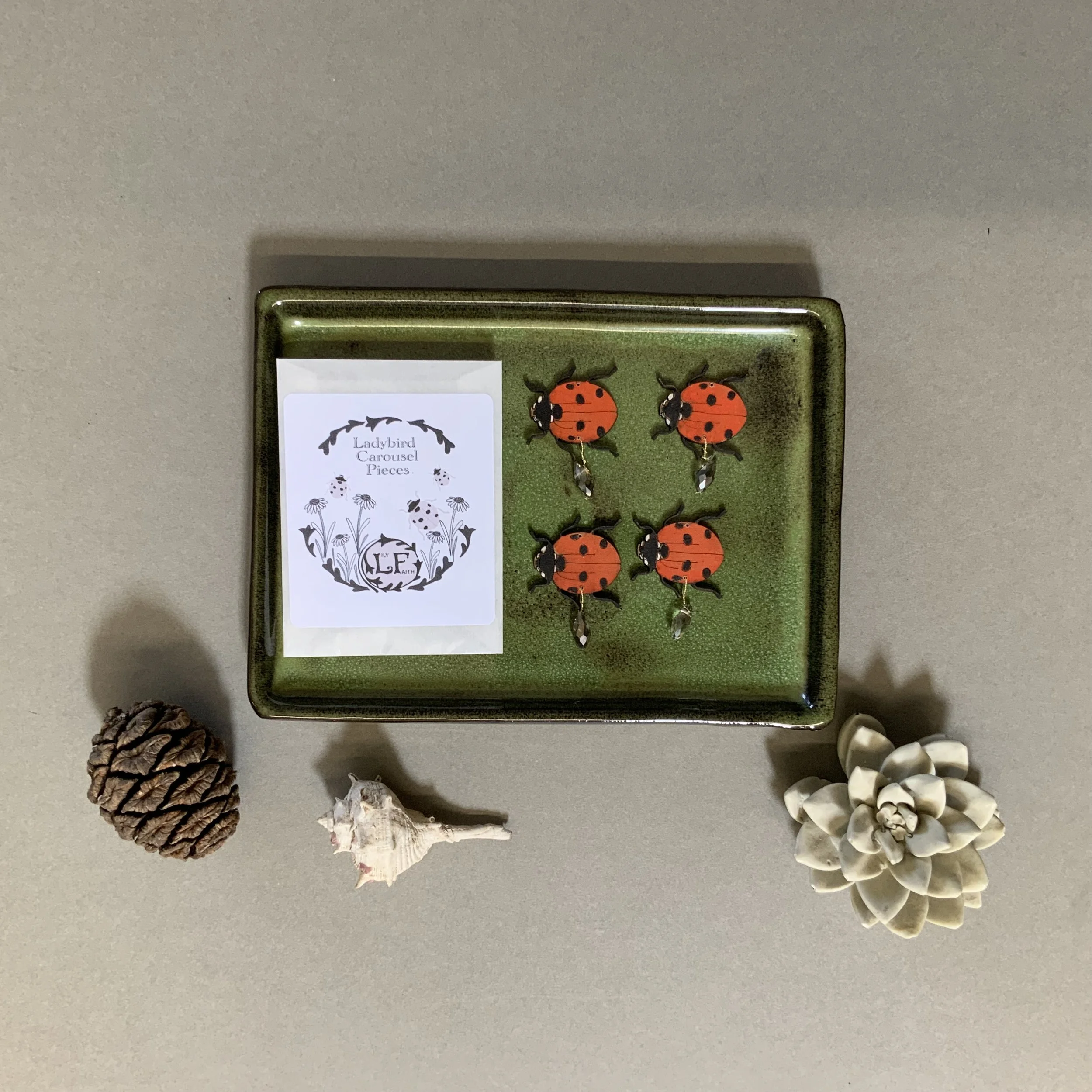 Lily Faith Ladybird candle carousel pieces are presented in a glassine envelope with a hand drawn Ladybird illustration on the packet. The perfect additional gift for candle carousels