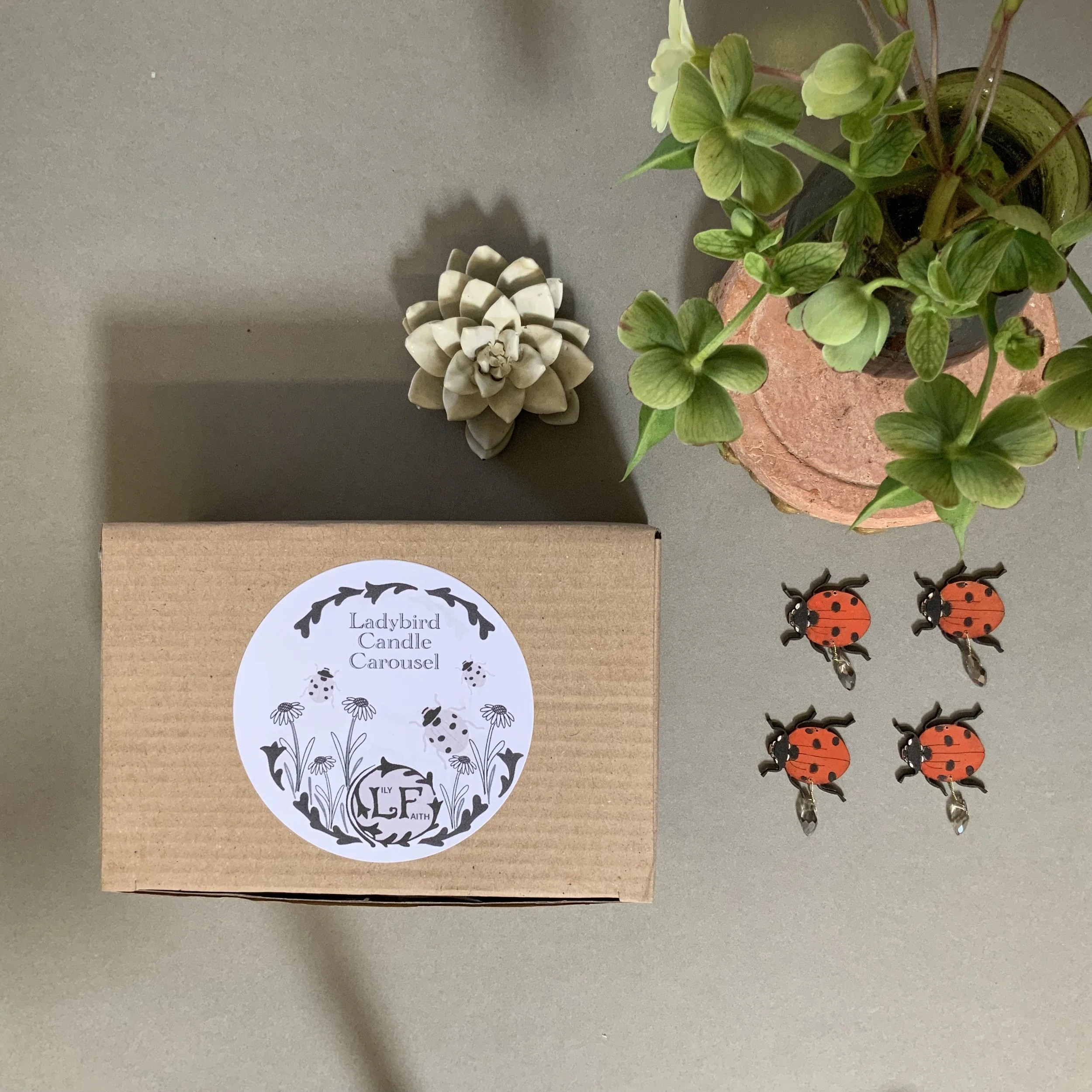 Lily Faith candle carousels are safely packaged in foam housing within a kraft box, with detailed instructions explaining how to construct and look after your candle carousel