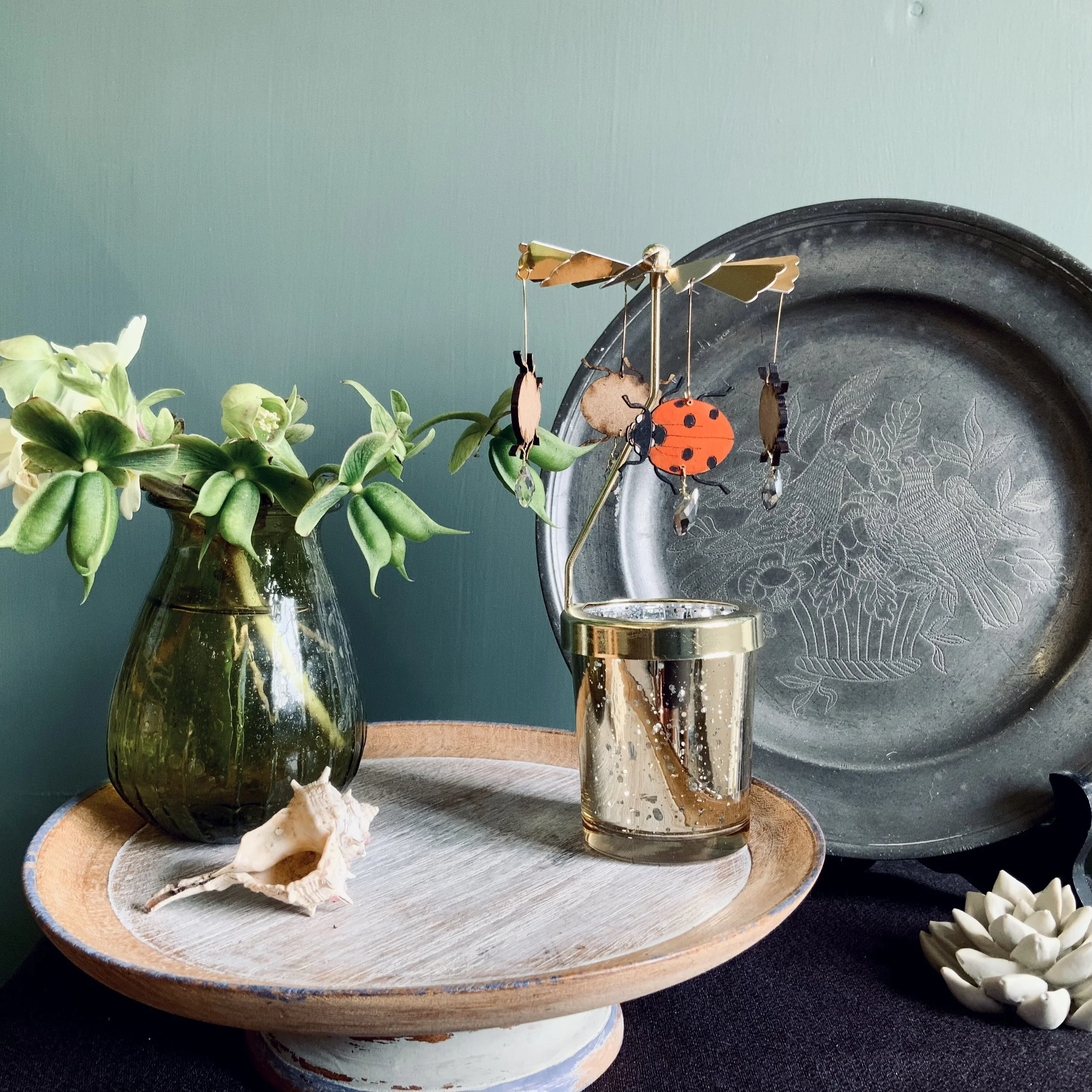 Lily Faith Ladybird candle carousel, featuring four lasercut ladybirds, hand painted with bold red and punchy black details