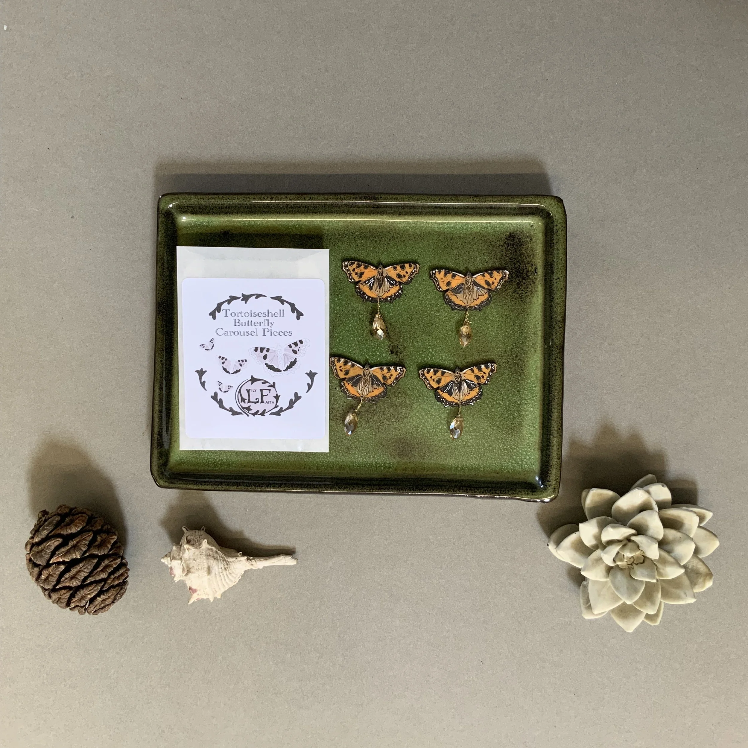 The Tortoiseshell Butterfly Candle carousel pieces are presented in a glassine envelope. This has a rendering of Lily's hand drawn Tortoiseshell Butterfly on the front. (Copy)