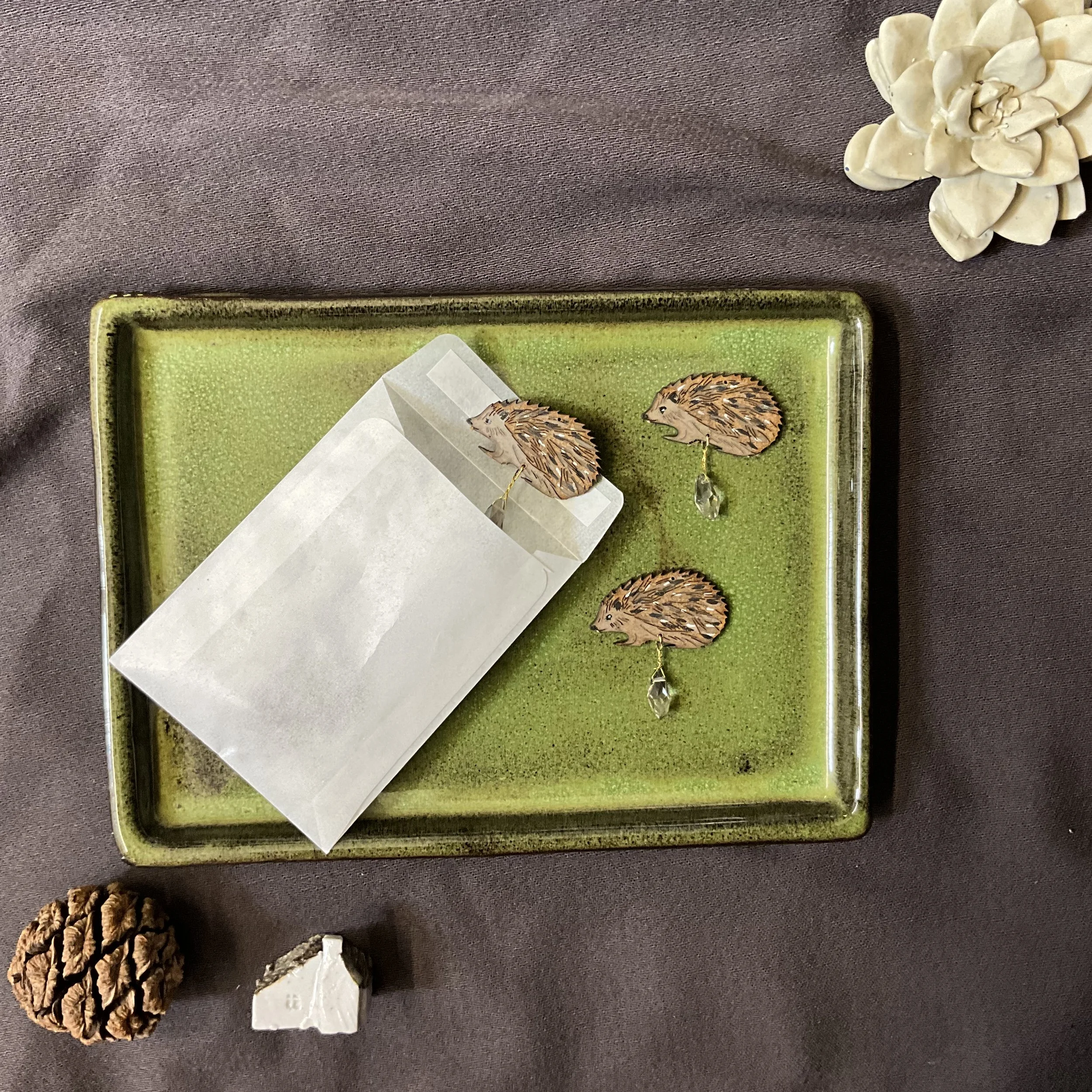 The FSC MDF wooden hedgehog decorations are safely stored in a glassine envelope, ready to be used on your candle carousel (Copy)