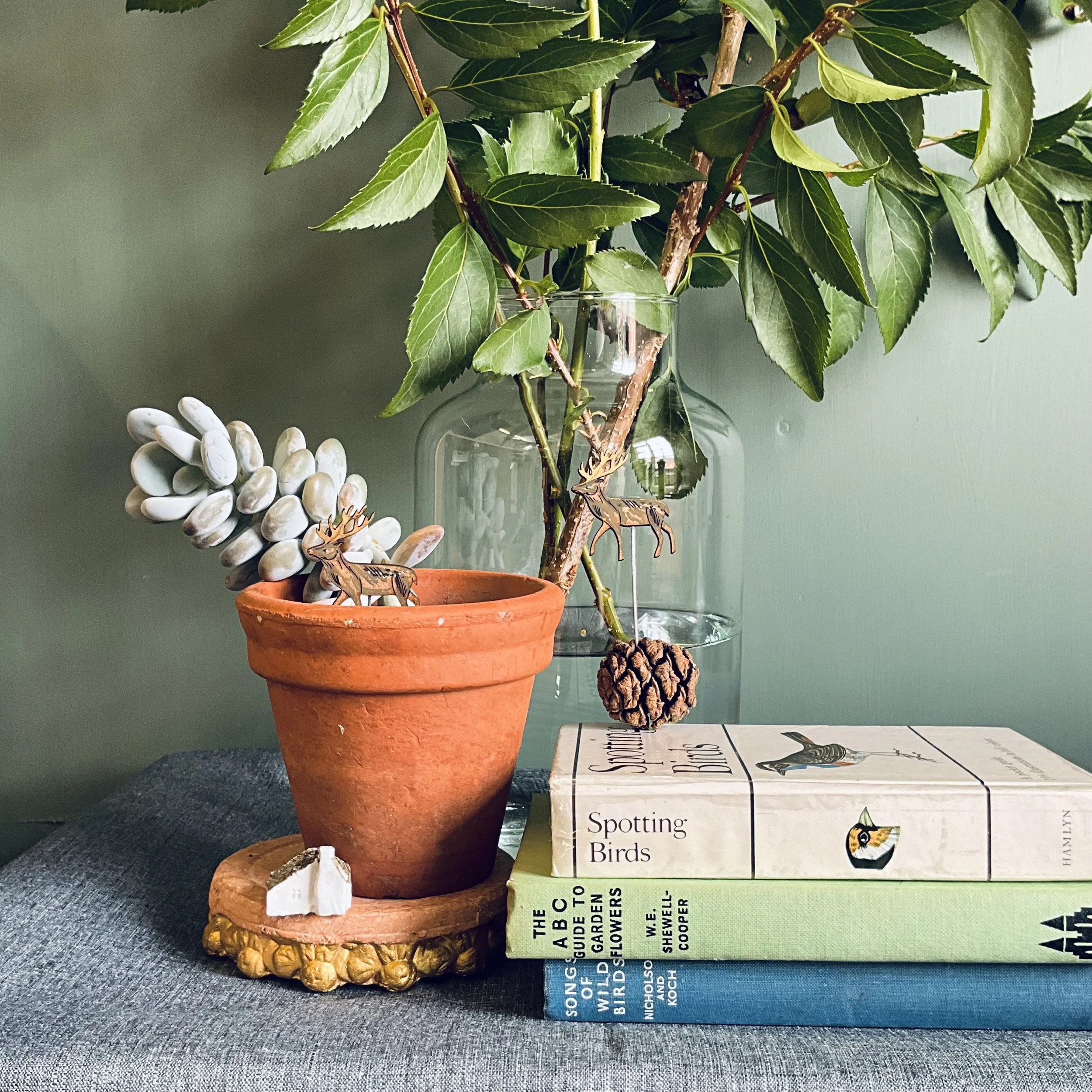 With their gilded antlers, the wooden stags have an autumnal air to them, but really they are perfect for all round. (Copy)