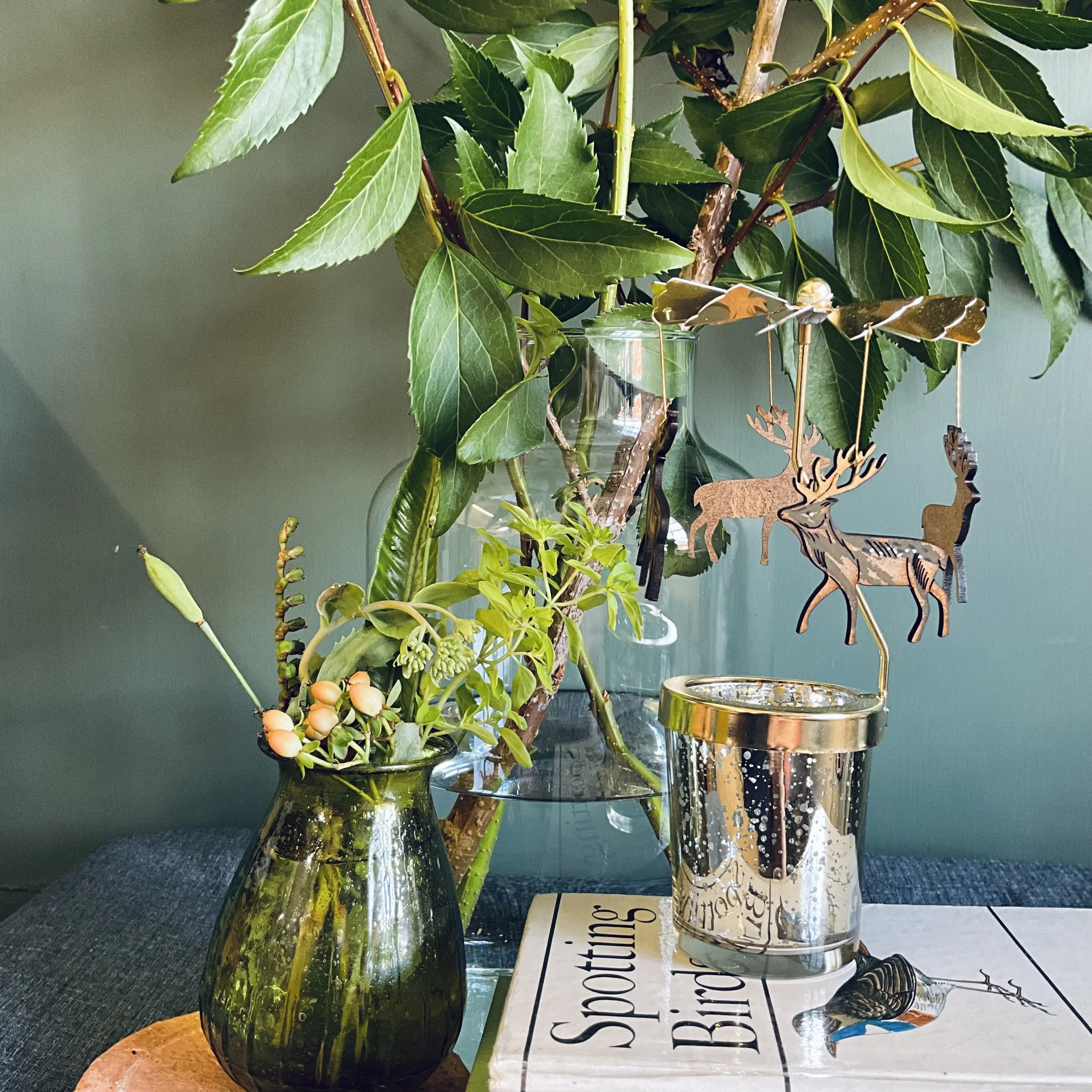 The gilded antlers of the stag compliment the gold tones of the glass votive and propeller  mechanism that makes the candle carousel spin (Copy)