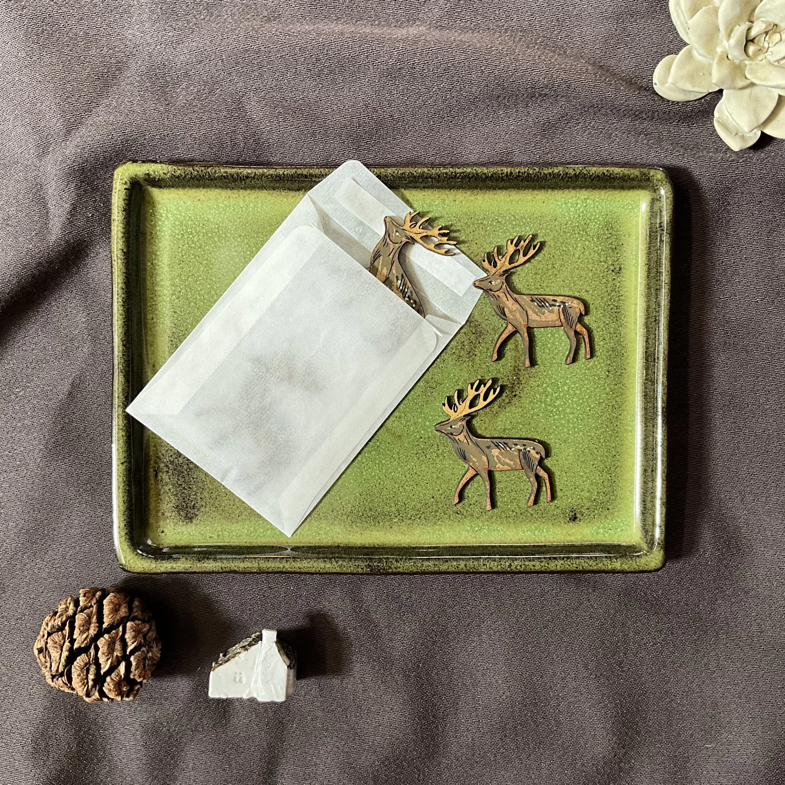 The stag pieces are packaged in a recyclable glassine envelope (Copy)