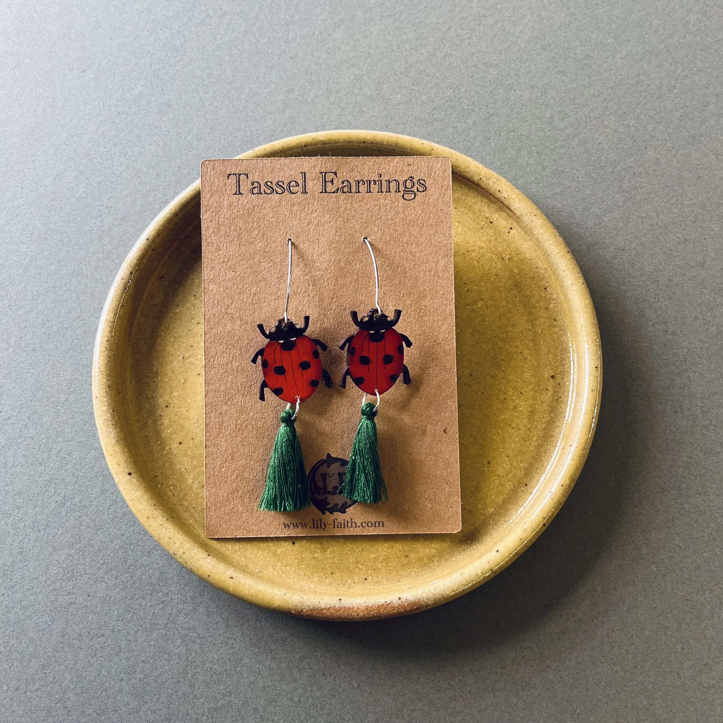 Ladybird Tassel earrings with bottle green tassels