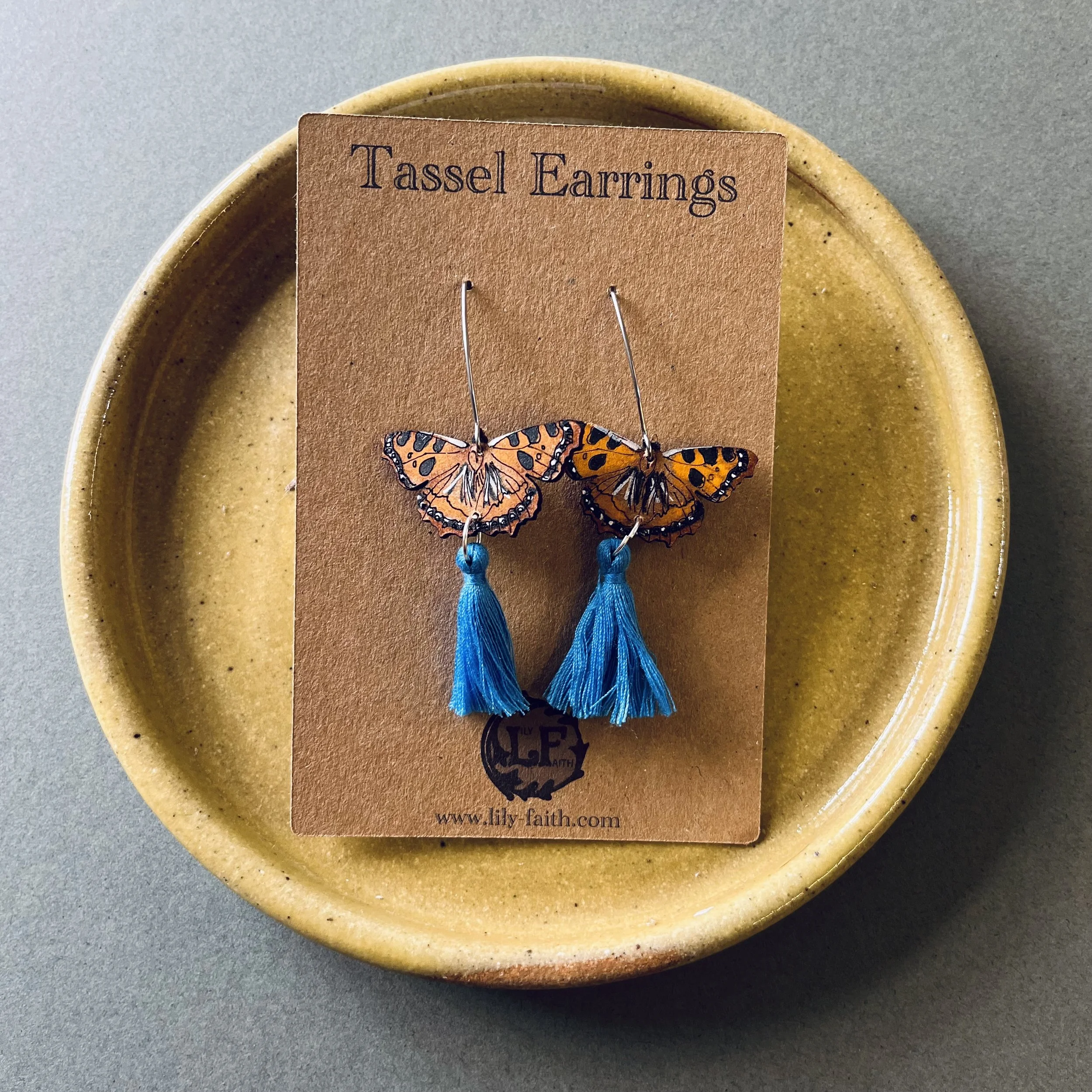 Tortoiseshell Butterfly Earrings with sky blue tassels