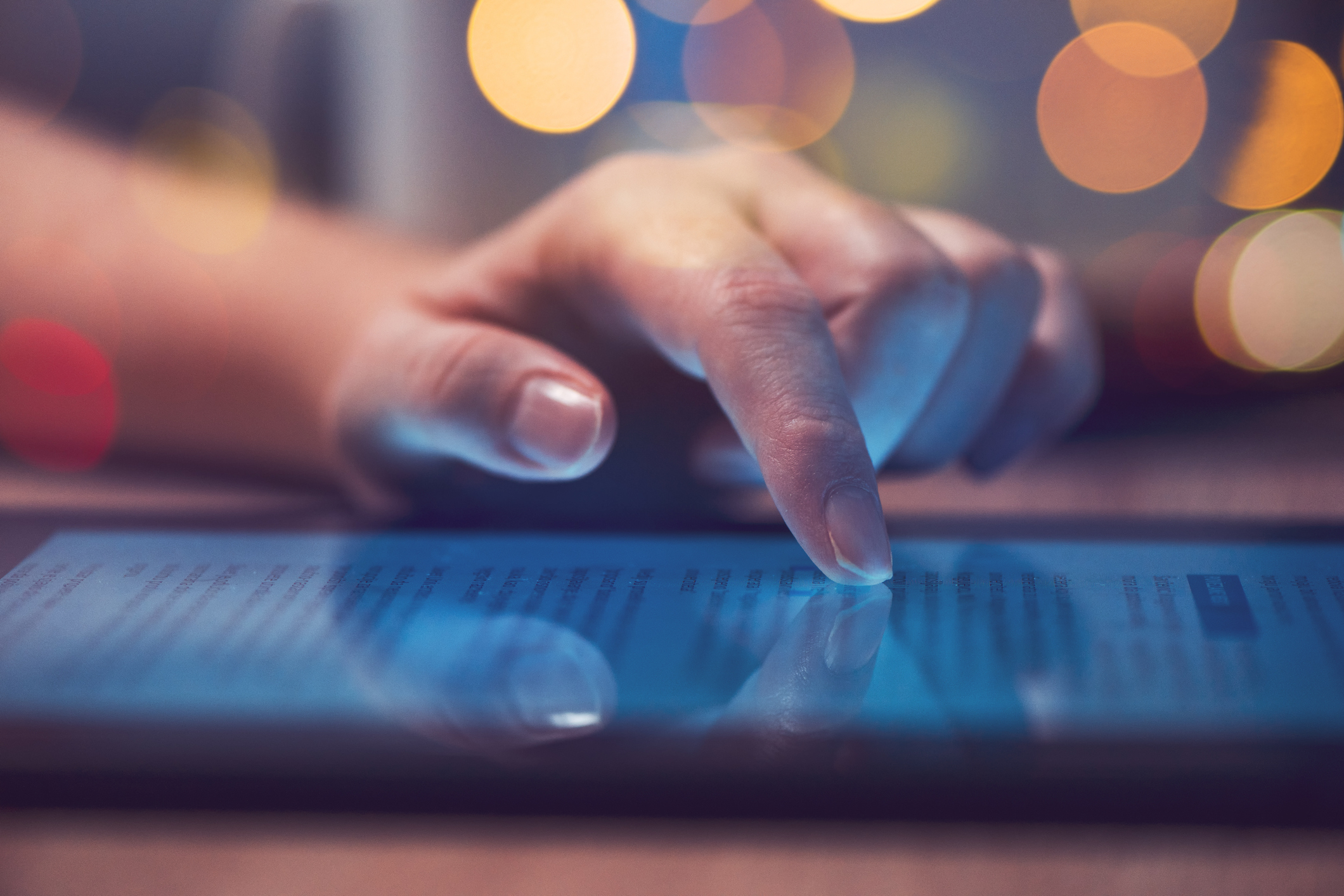 Woman-reading-online-news-on-digital-tablet-918656496_2122x1416.jpeg