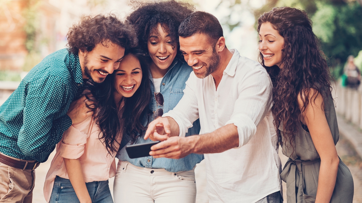 Friends-looking-at-a-smart-phone-823901298_1258x838.jpeg