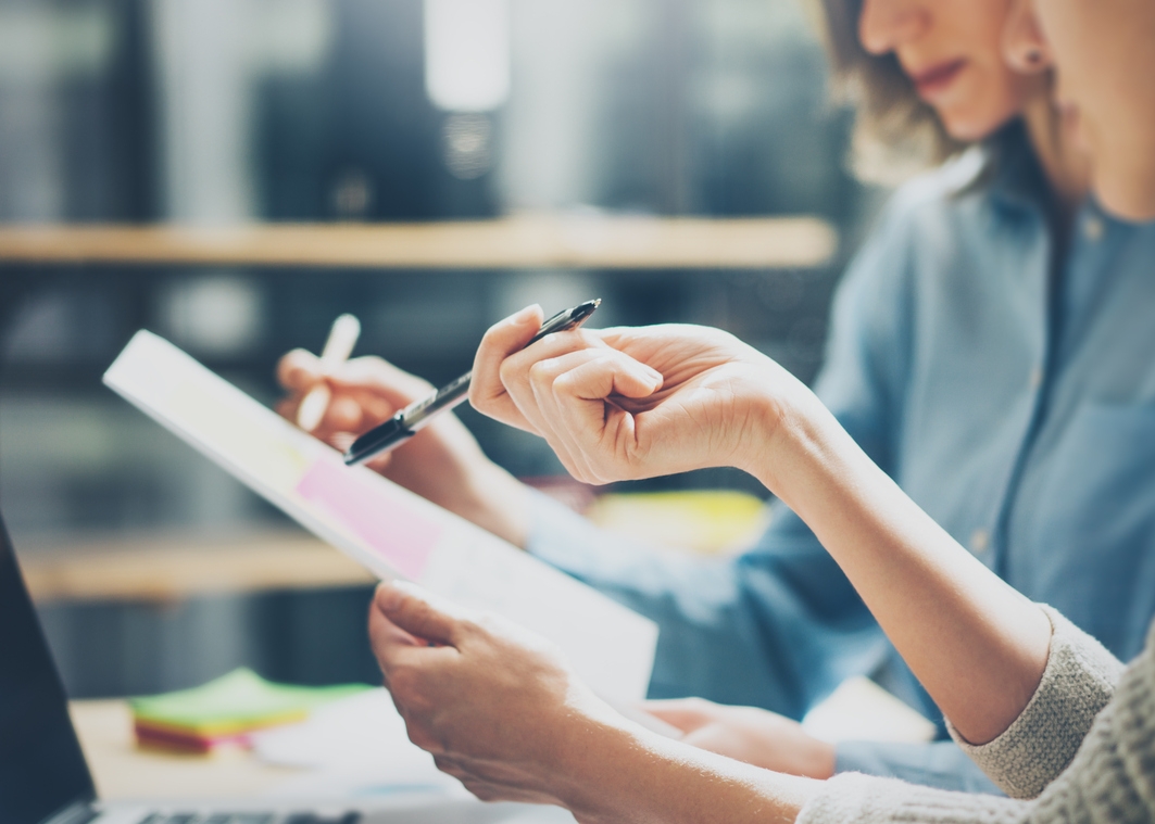 Group-of-young-coworkers-working-together-in-modern-office.Woman-talking-with-colleague-about-new-startup-project.Business-people-brainstorming-concept.Selective-focus.Horizontal,blurred.-670073416_1385x760.jpeg