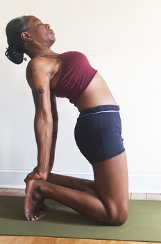 ustrasana. (camel pose): toes tucked.
