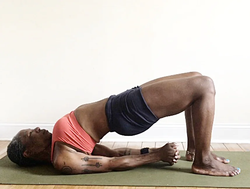 setu bandha sarvangasana. (bridge pose) feet hips distance apart. heels under knees. press into feet & shoulders, loosen glutes
