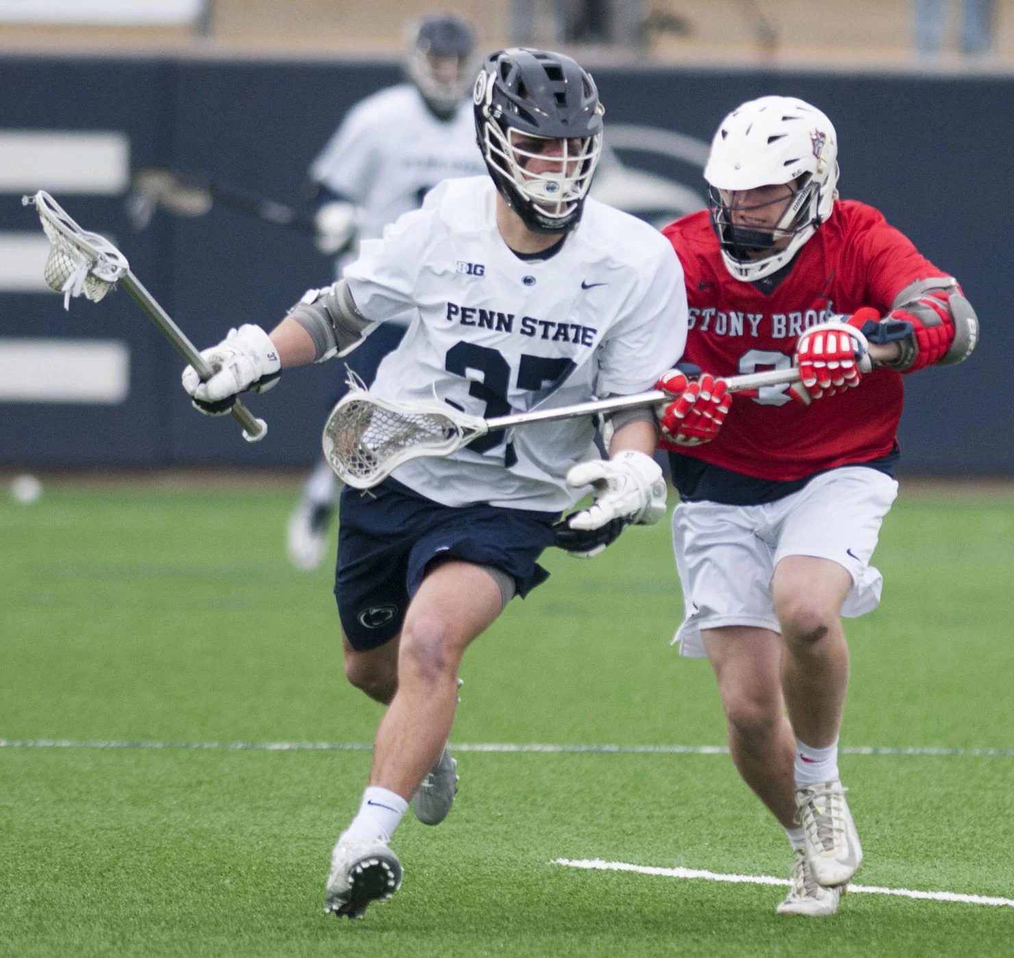 Attacker Connor Howell (3) tries to stop midfielder Bobby Burns (37) during the Penn State v. Stony Brook men’s lacrosse game at Panzer Stadium on Saturday, Feb. 17, 2018. Penn State defeated Stony Brook 15-8.