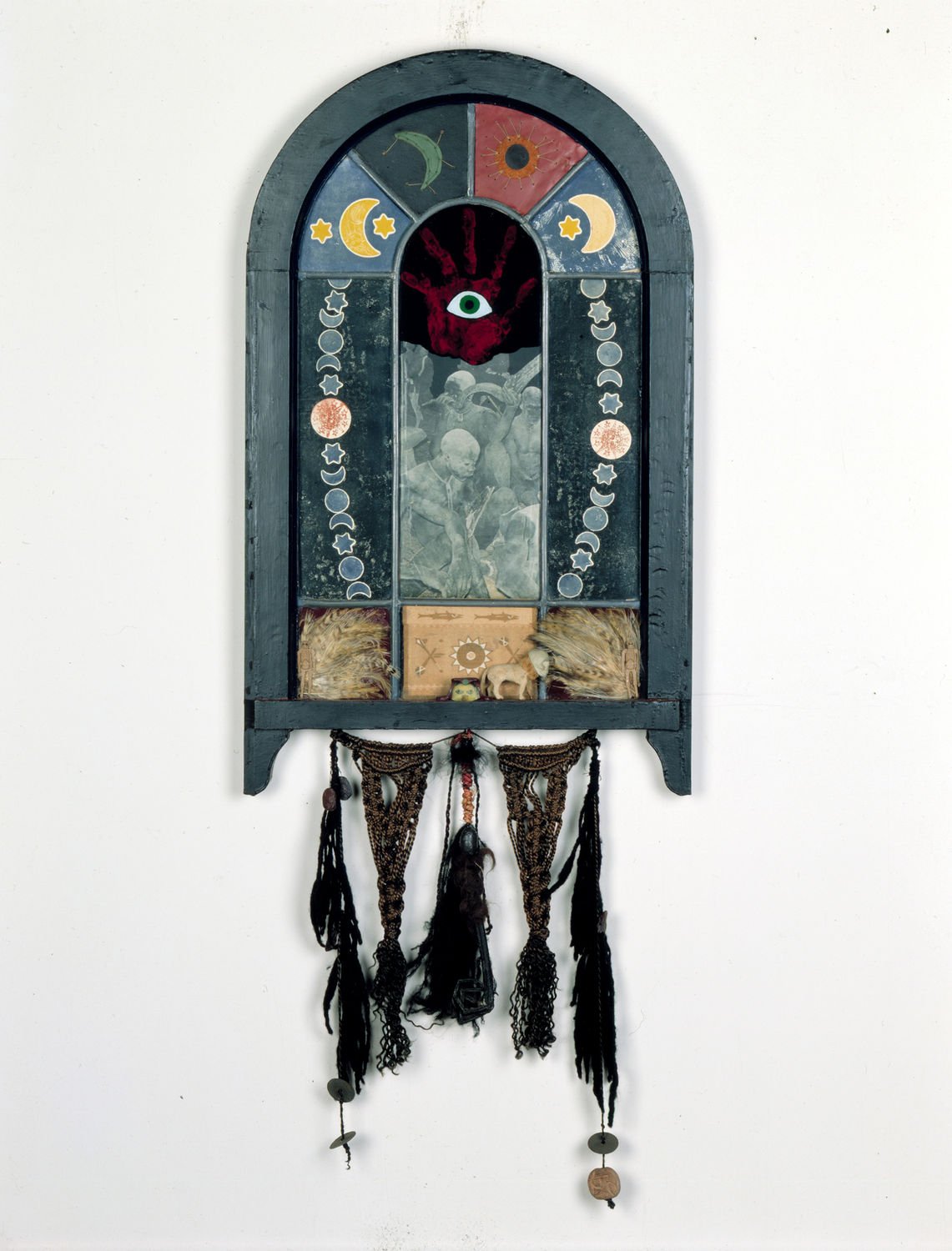  Betye Saar,  Nine Mojo Secrets , 1971  Wood, paper, acrylic paint, fabric, glass, feathers, yarn, metal, beads, plastic objects. 49 3/4 × 23 1/2 × 1 3/4 in. 