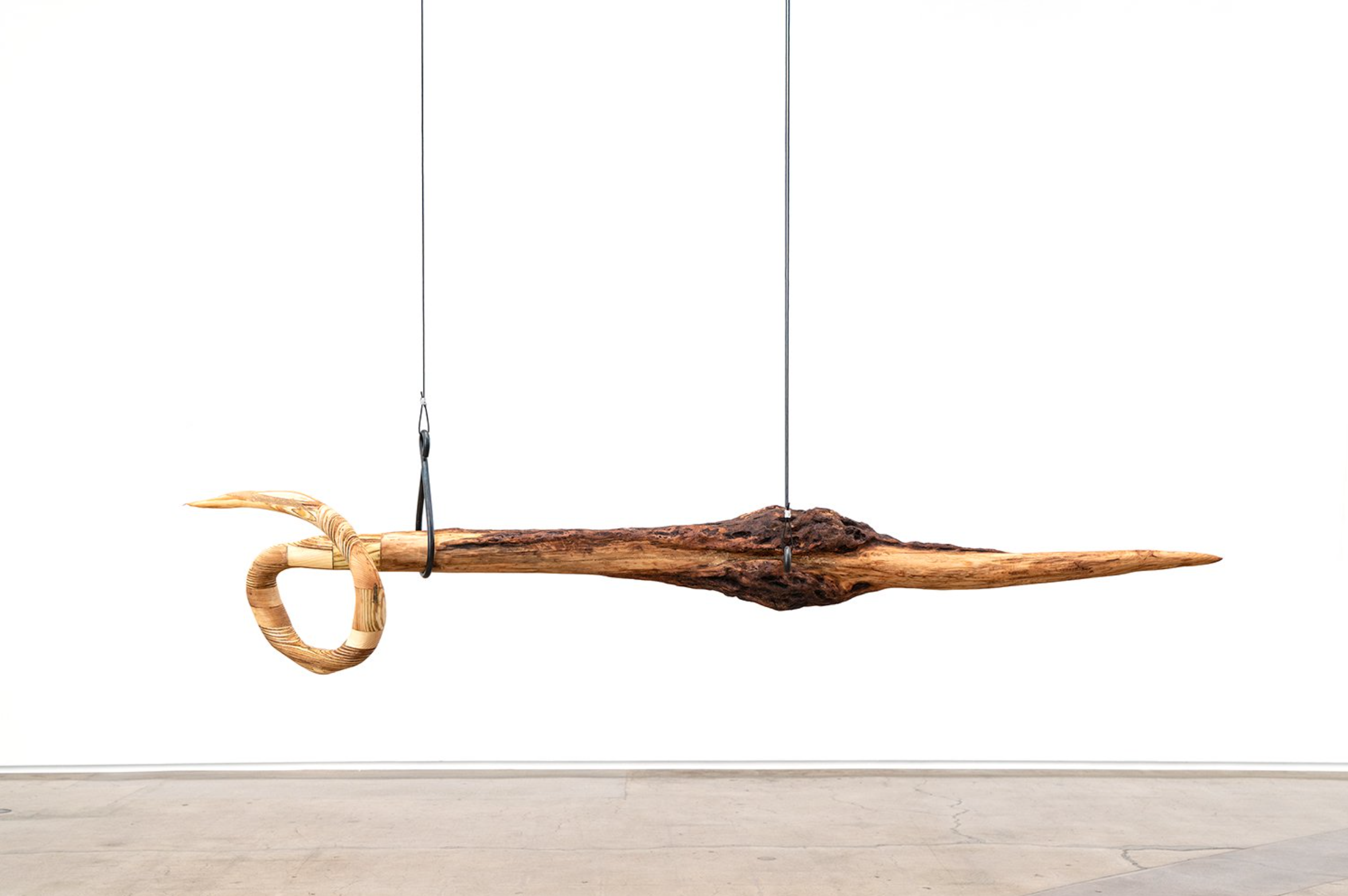   Alicia Adamerovich, "choking on my words," 2022, maple tree, found wood, forged steel rods and aircraft cable, 18 x 78 x 15 inches  