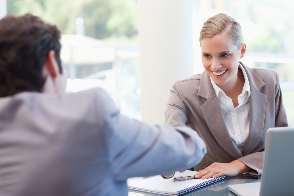 Manager interviewing a male applicant in her office.jpeg