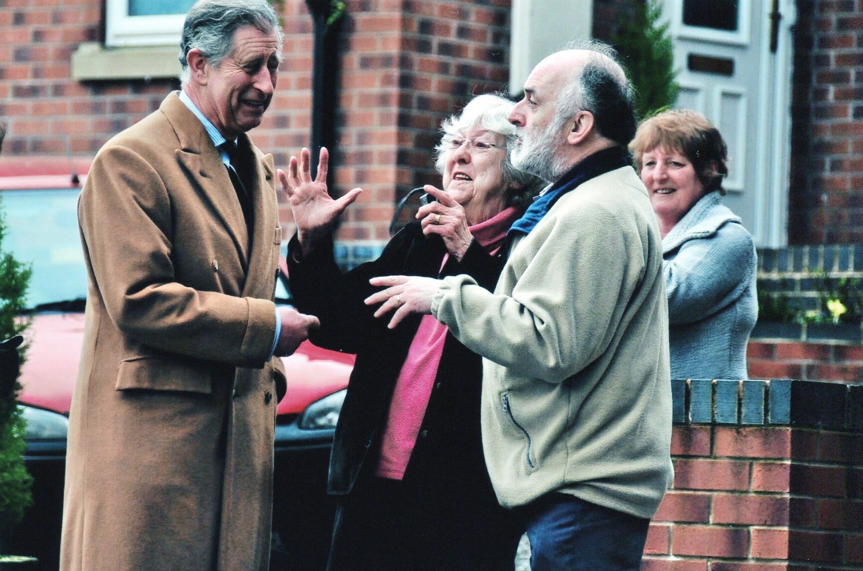  This picture is of my mother and stepfather, Pauline and David Roberts, explaining to the Prince of Wales why their village of Froncysyllte is a great place to live. My mother's excitement and Prince Charles amusement is written all over their faces