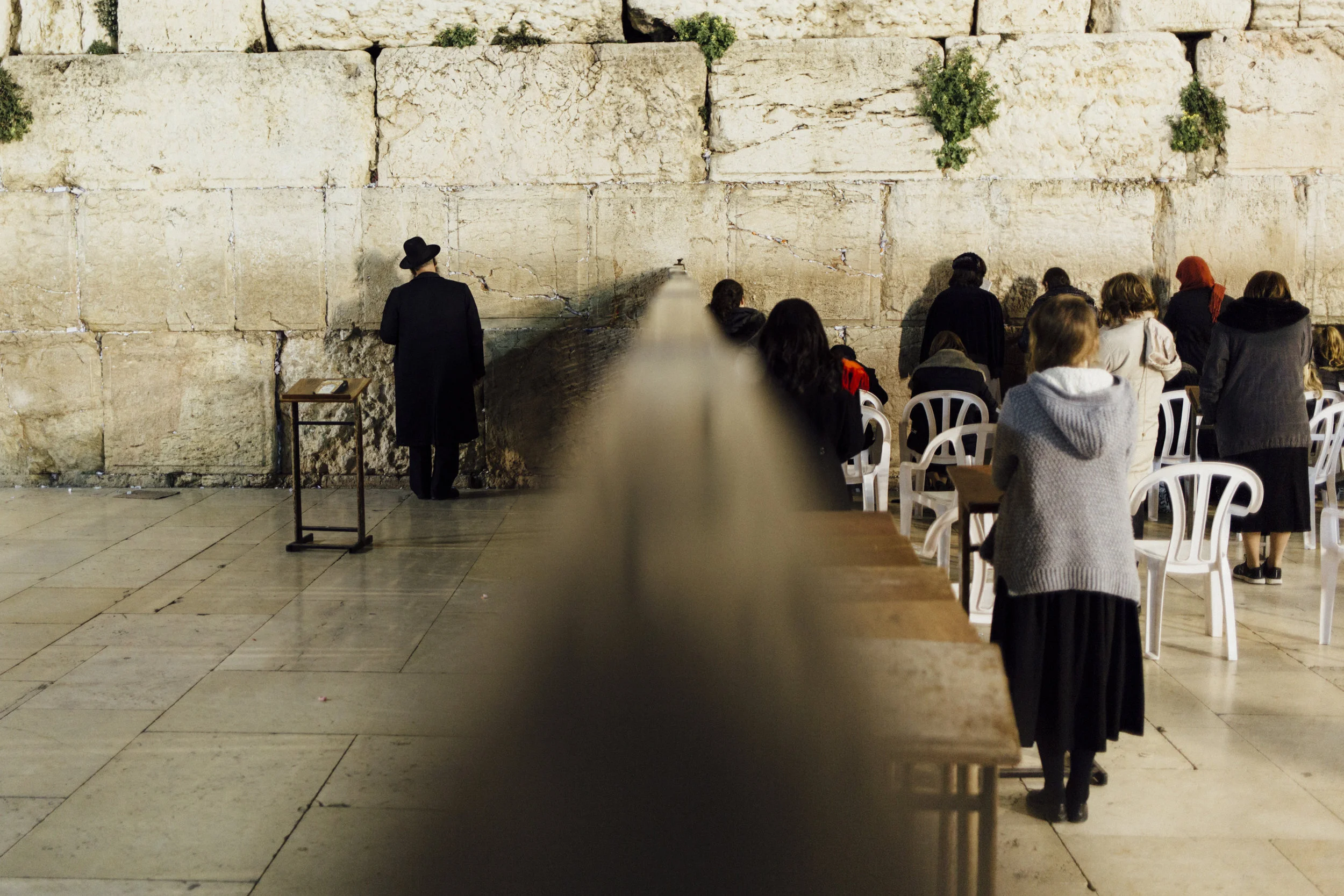  Old differences.&nbsp;Men and women pray in different areas separated by another wall. Jerusalem, 2017. 