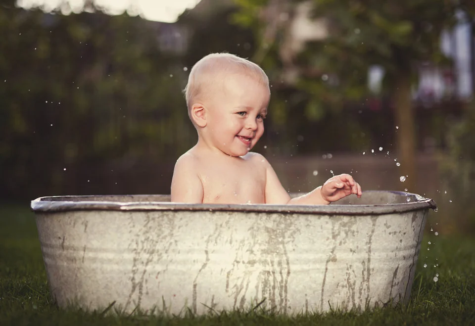 little-boy-bathing-outside-PKWZZBF.JPG
