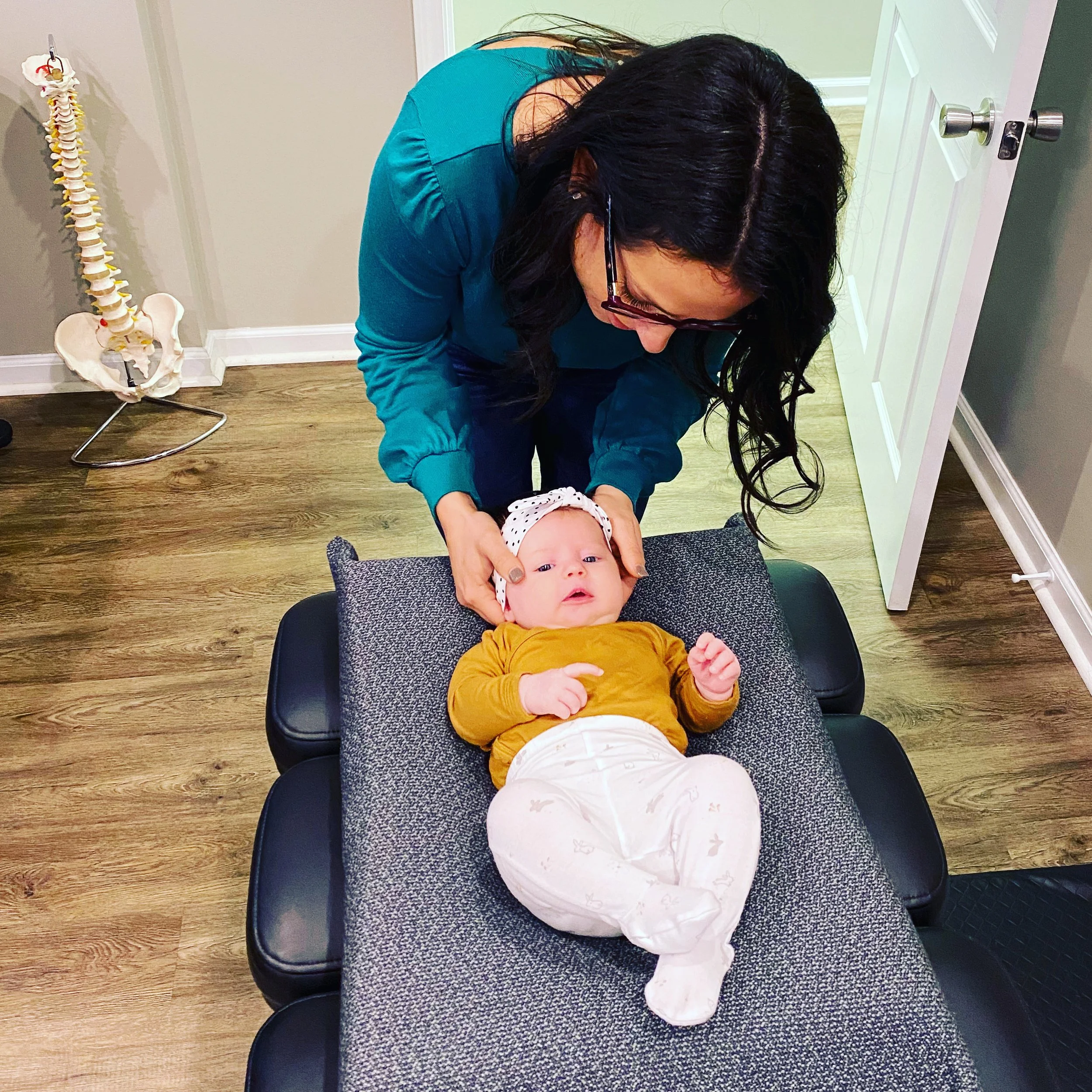 Baby receiving pediatric chiropractic care in Hendersonville NC