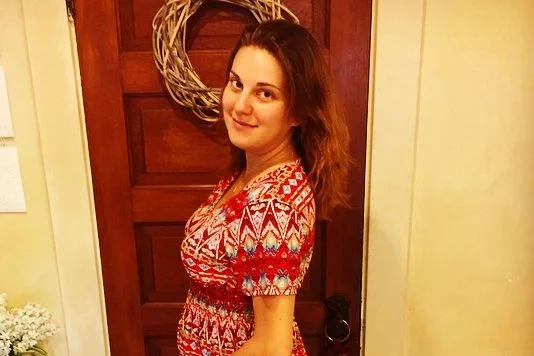 Katie Easterday standing in front of a door