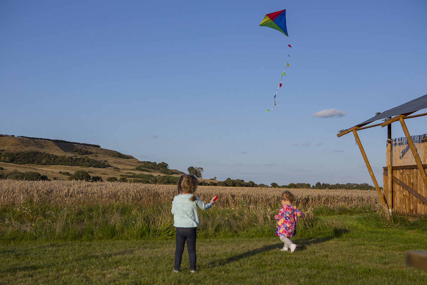 Children flying kite at Wheatfields Luxury Glamping